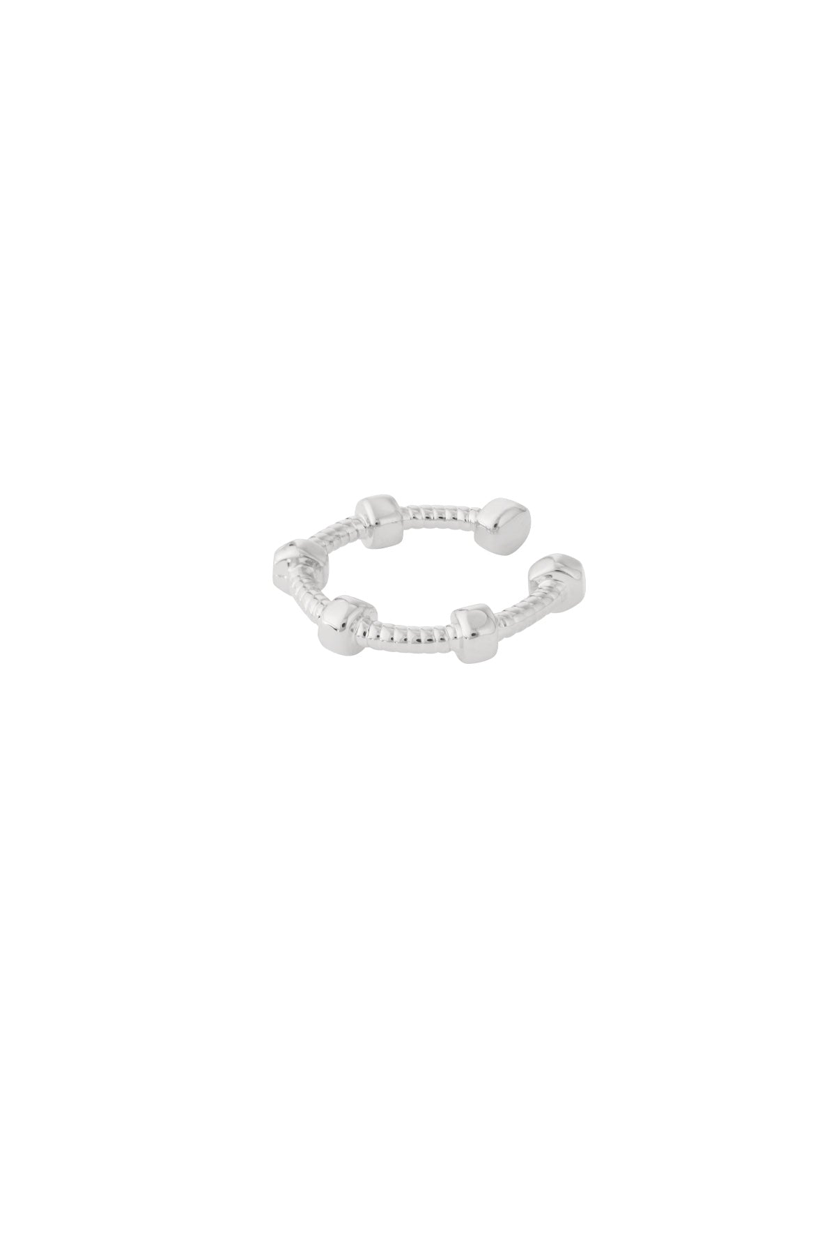 Silver geometric ear cuff shown on white background with textured band and cubic nodes
