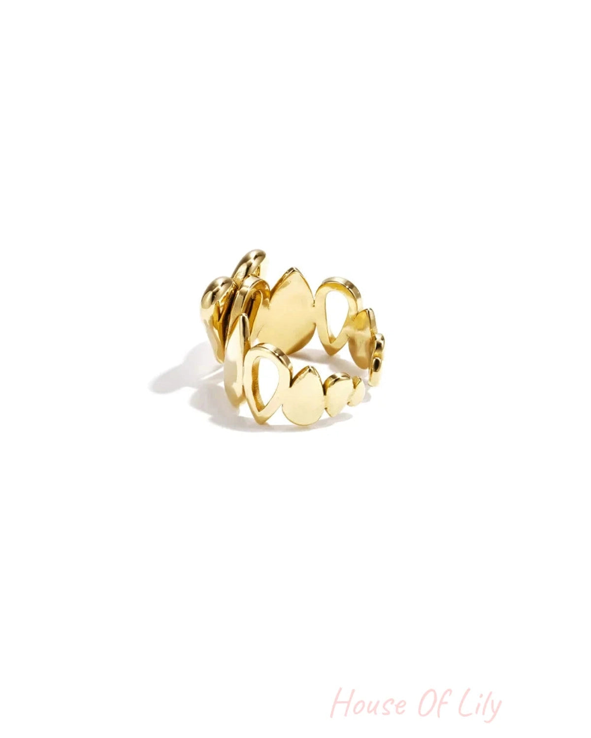 Polished gold ring featuring a cutout design of teardrop and oval shapes.