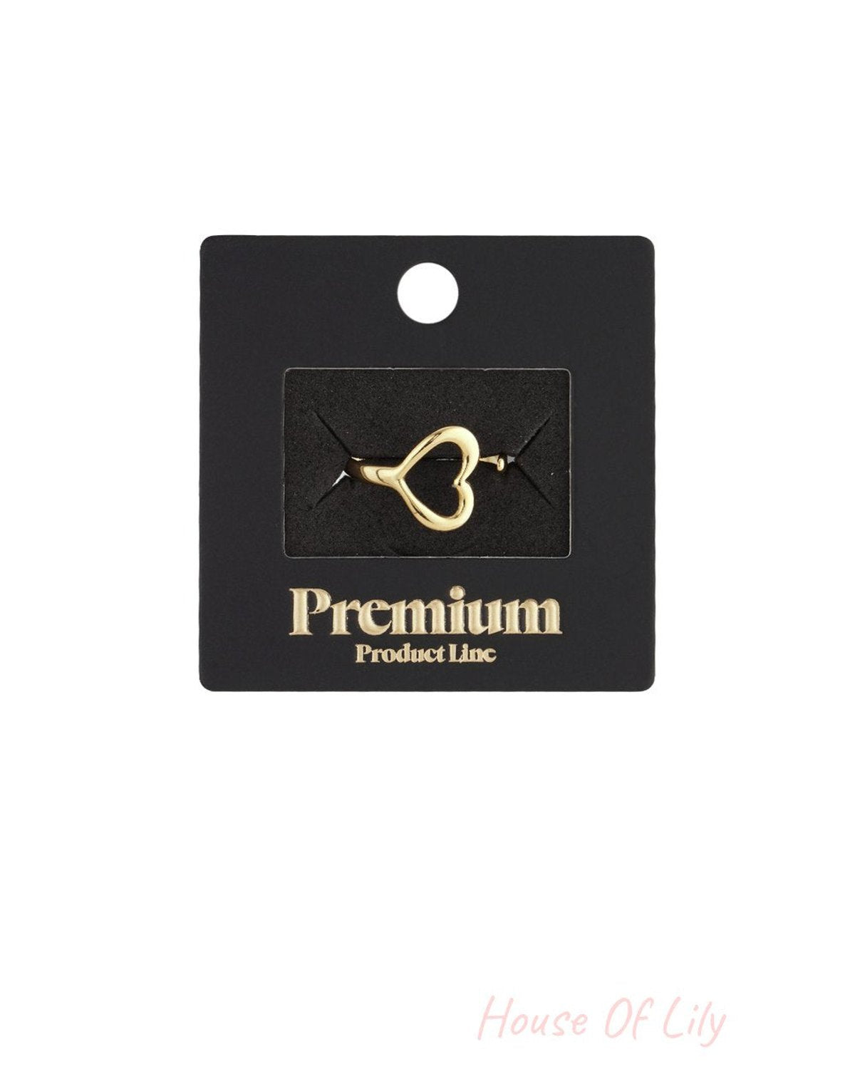 Gold Flipside Heart Ring on black display card, featuring a minimalist open-heart shape and polished metal finish.