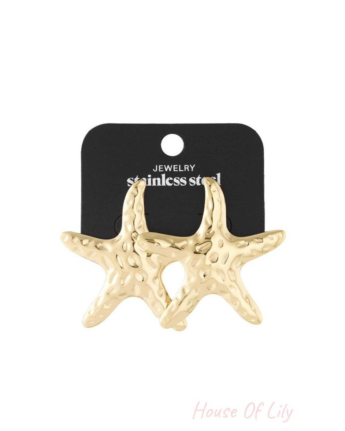 Gold-tone stainless steel Starfish Chaos stud earrings with a textured, hammered finish on a black display card.