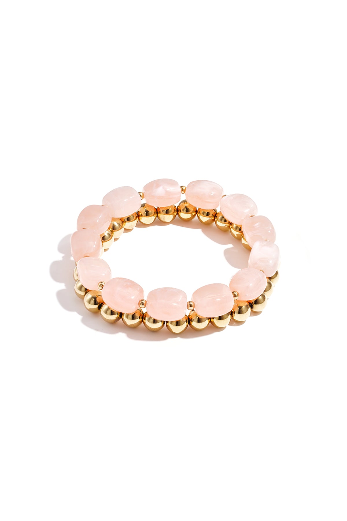 Light blue marbled acrylic beaded bracelet combined with shiny gold-tone beaded bracelet on white background