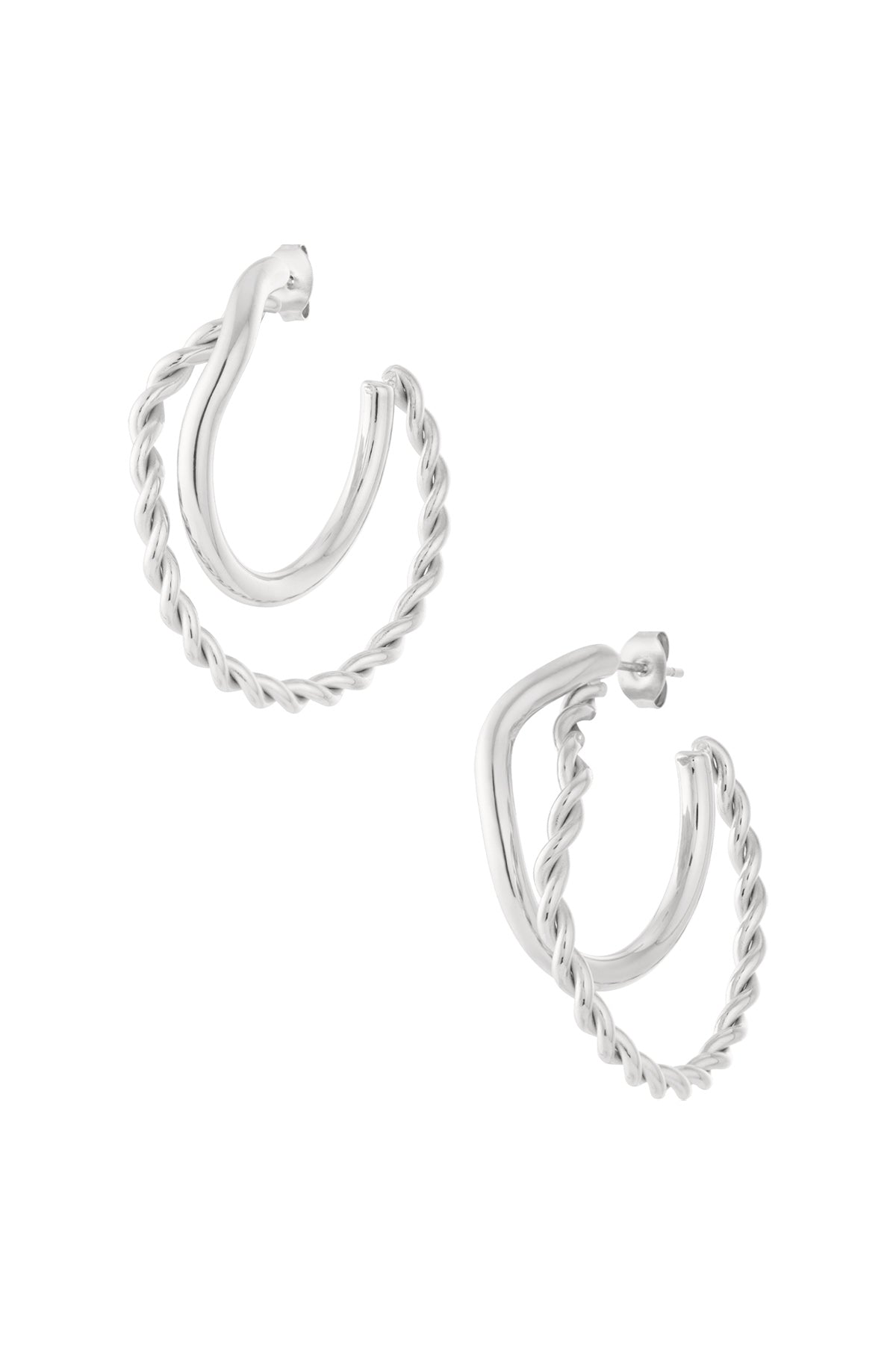 Pair of silver hoop earrings featuring one smooth and one twisted braided hoop, studio white background