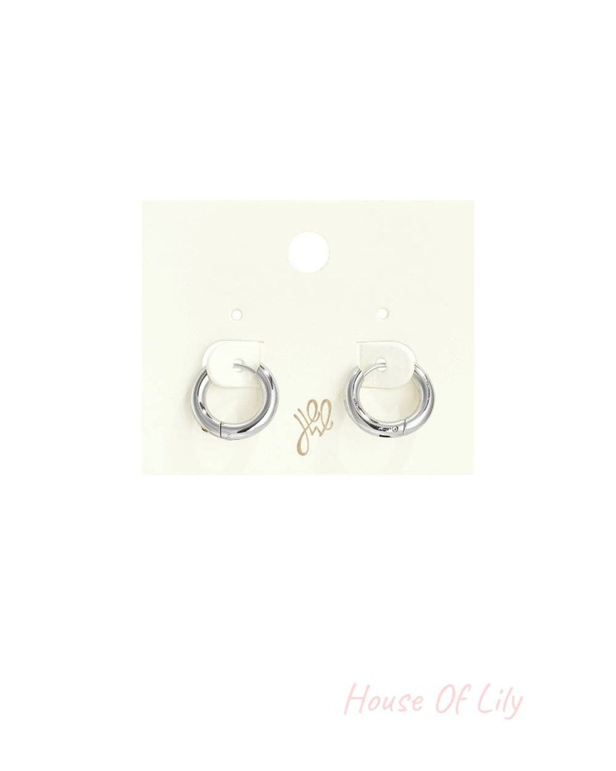 Small, silver Puffy Cloud Hoops earrings with a thick, rounded, polished finish on a white retail display card.