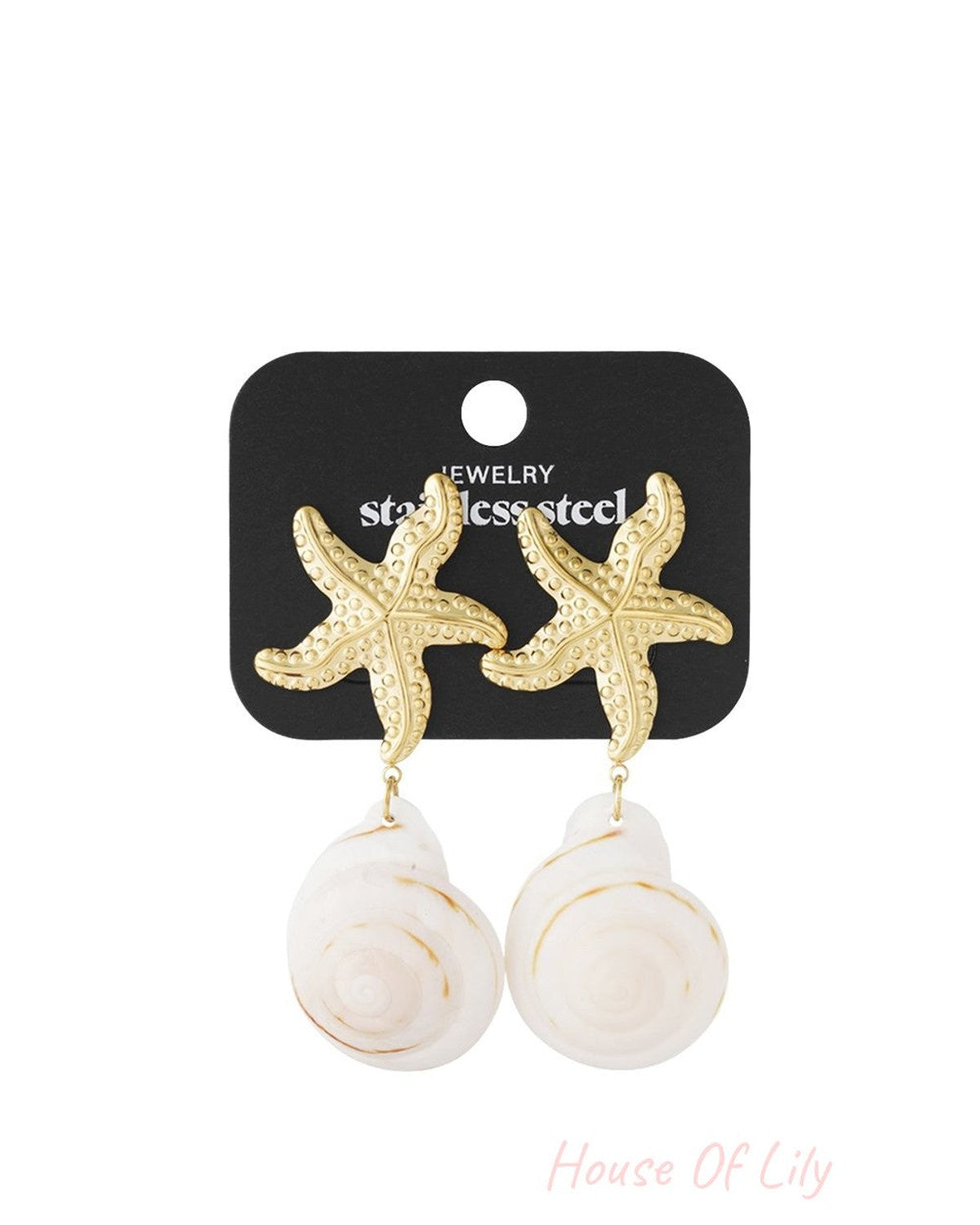 Gold starfish studs with dangling white spiral seashells on a black display card. Coastal style jewelry.
