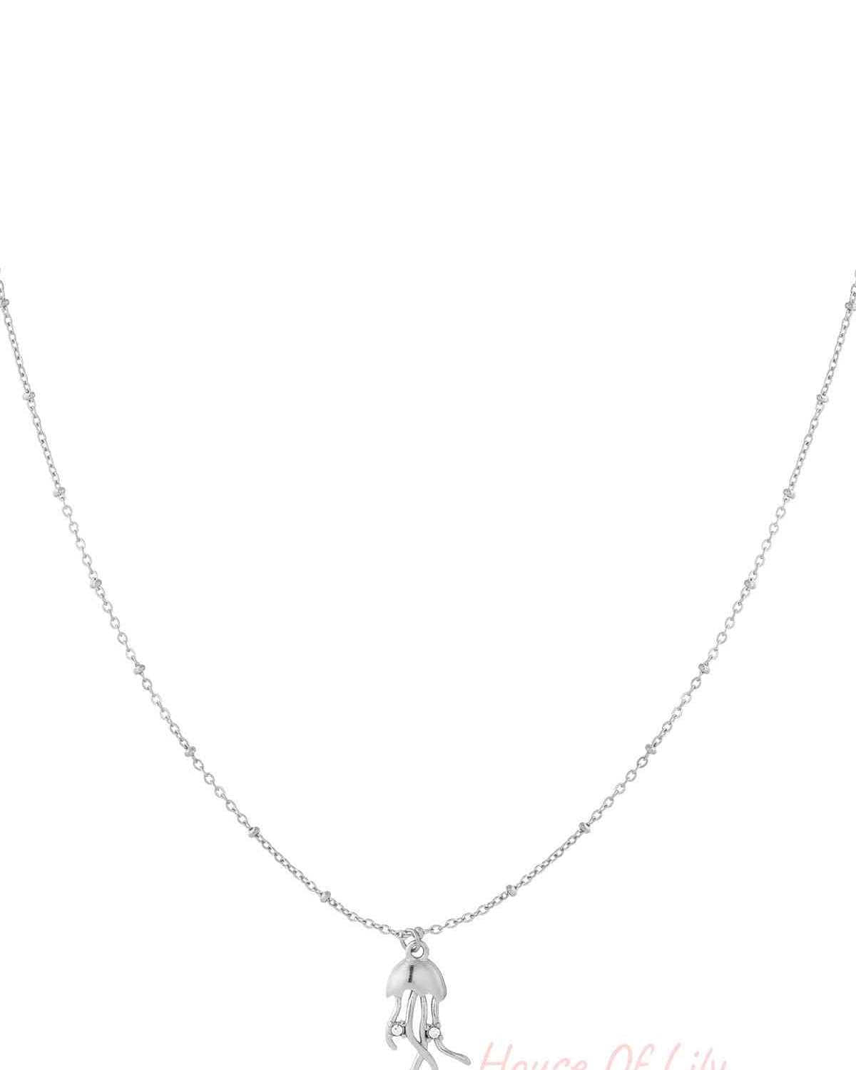 Silver jellyfish pendant necklace with delicate beaded chain on white background
