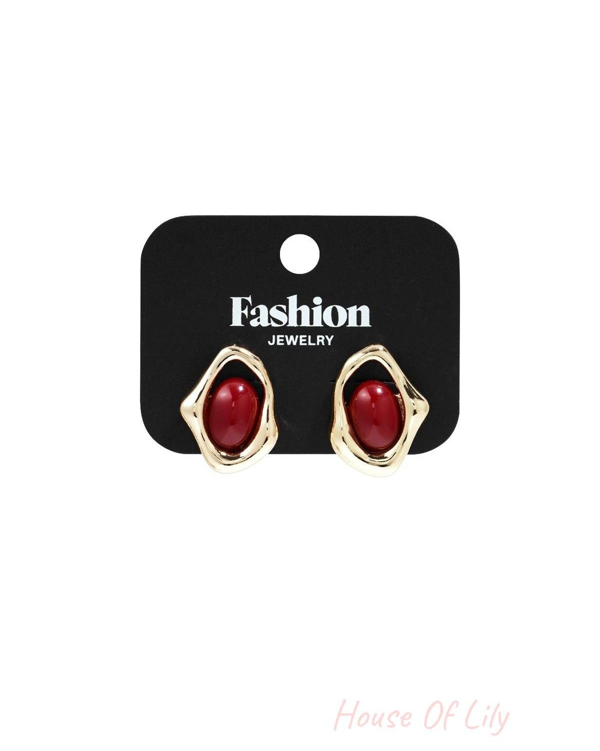 Golden Glitch Hoops: Irregular gold-tone frames surrounding smooth, oval-shaped red cabochon stones.