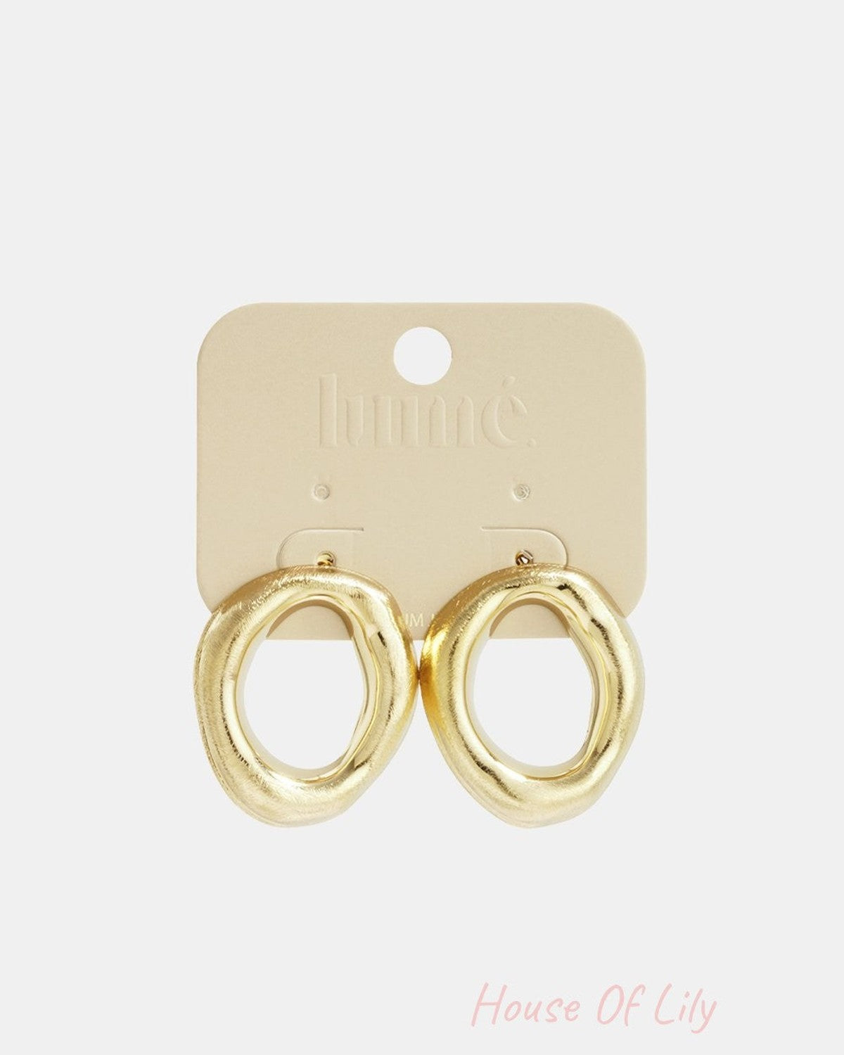 Gold-tone stud earrings with a textured, organic, melted-liquid loop shape on a branded beige display card.