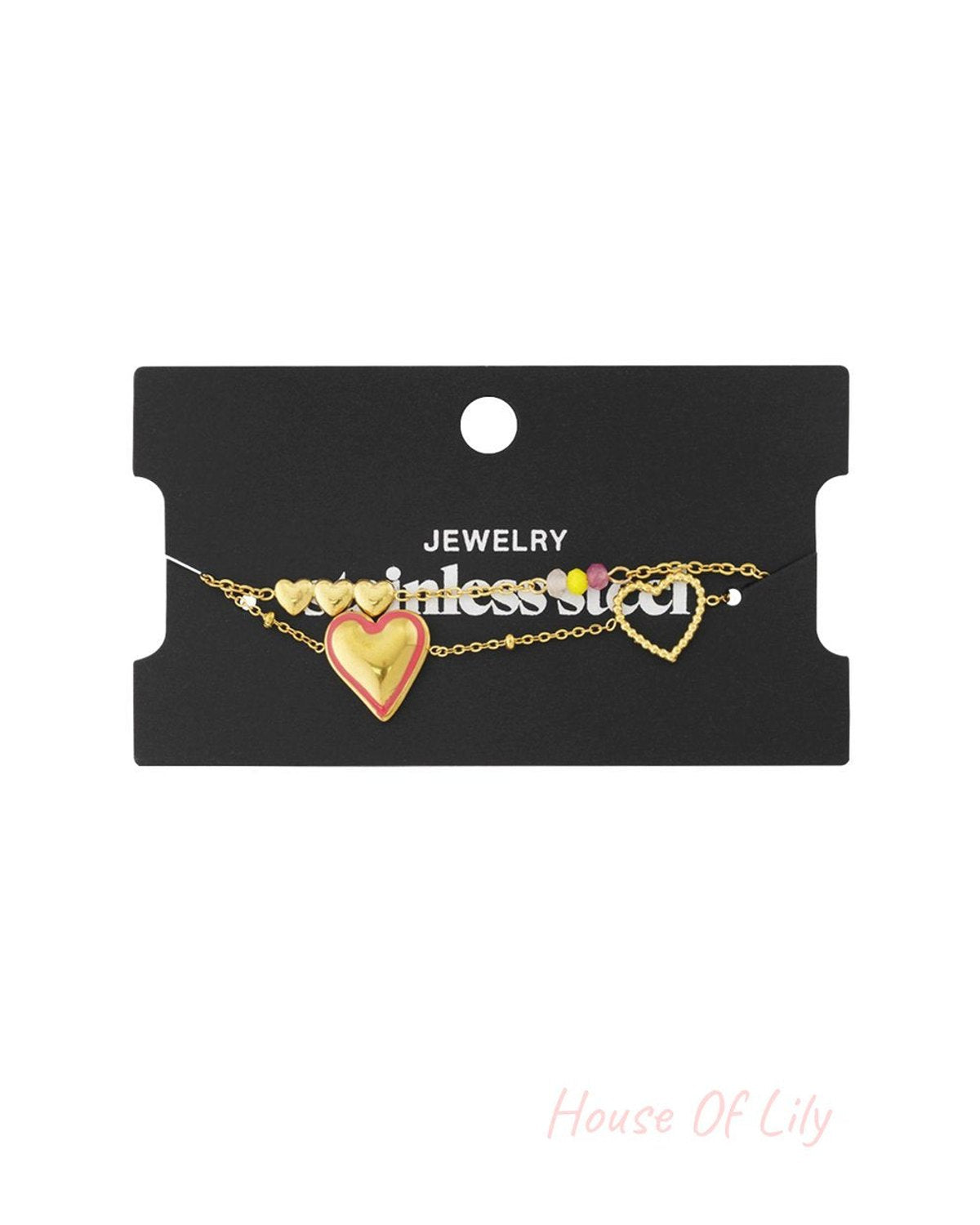 Gold stainless steel chain bracelet with a pink-rimmed heart charm, small heart charms, and multicolored beads.