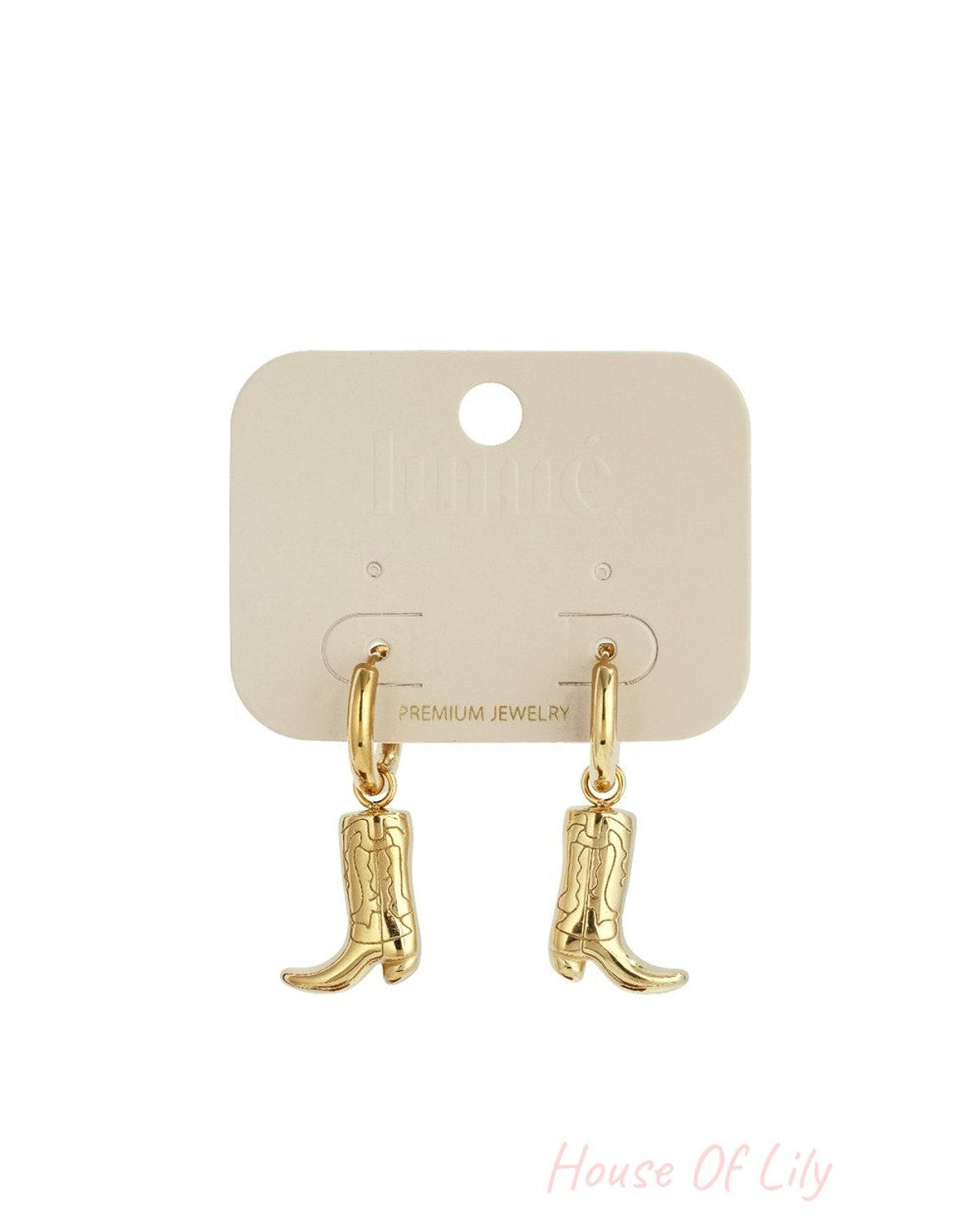 Bootin' Around earrings: Gold-toned hoop earrings featuring dangling cowboy boot charms on a display card.