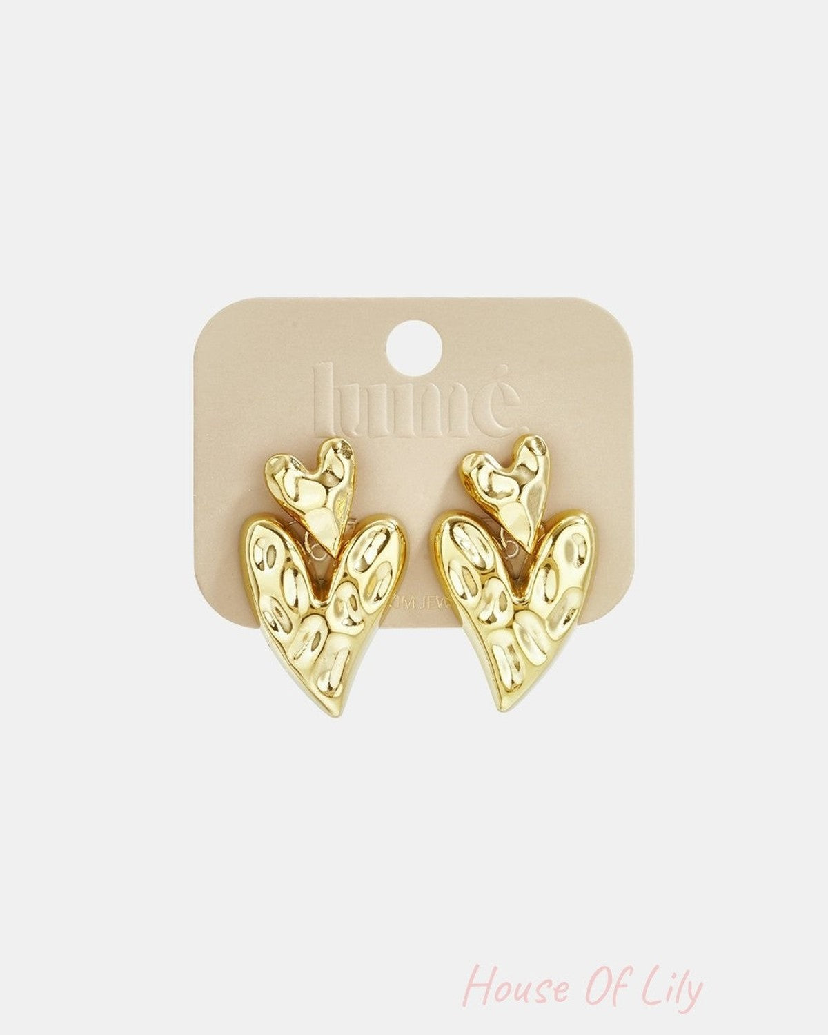 Gold, hammered-texture double heart drop earrings on a branded display card.