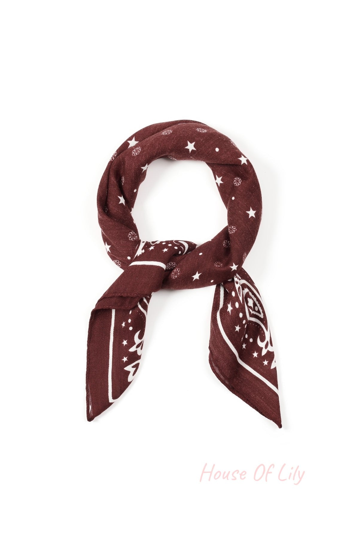 Burgundy polka dot bandana scarf neatly folded and arranged showing the pattern