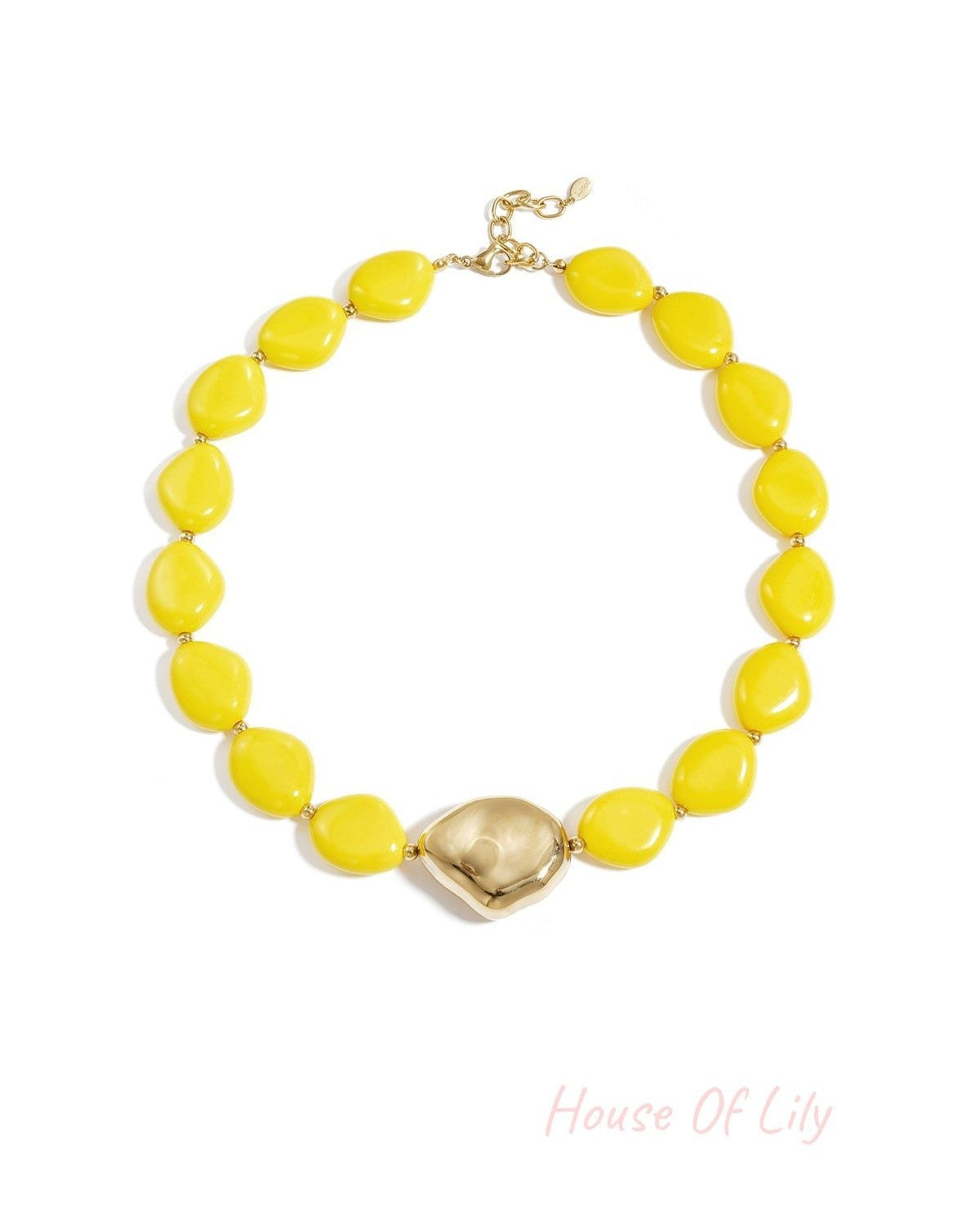 Bright yellow beaded necklace featuring irregular beads and gold-tone centerpiece on white background