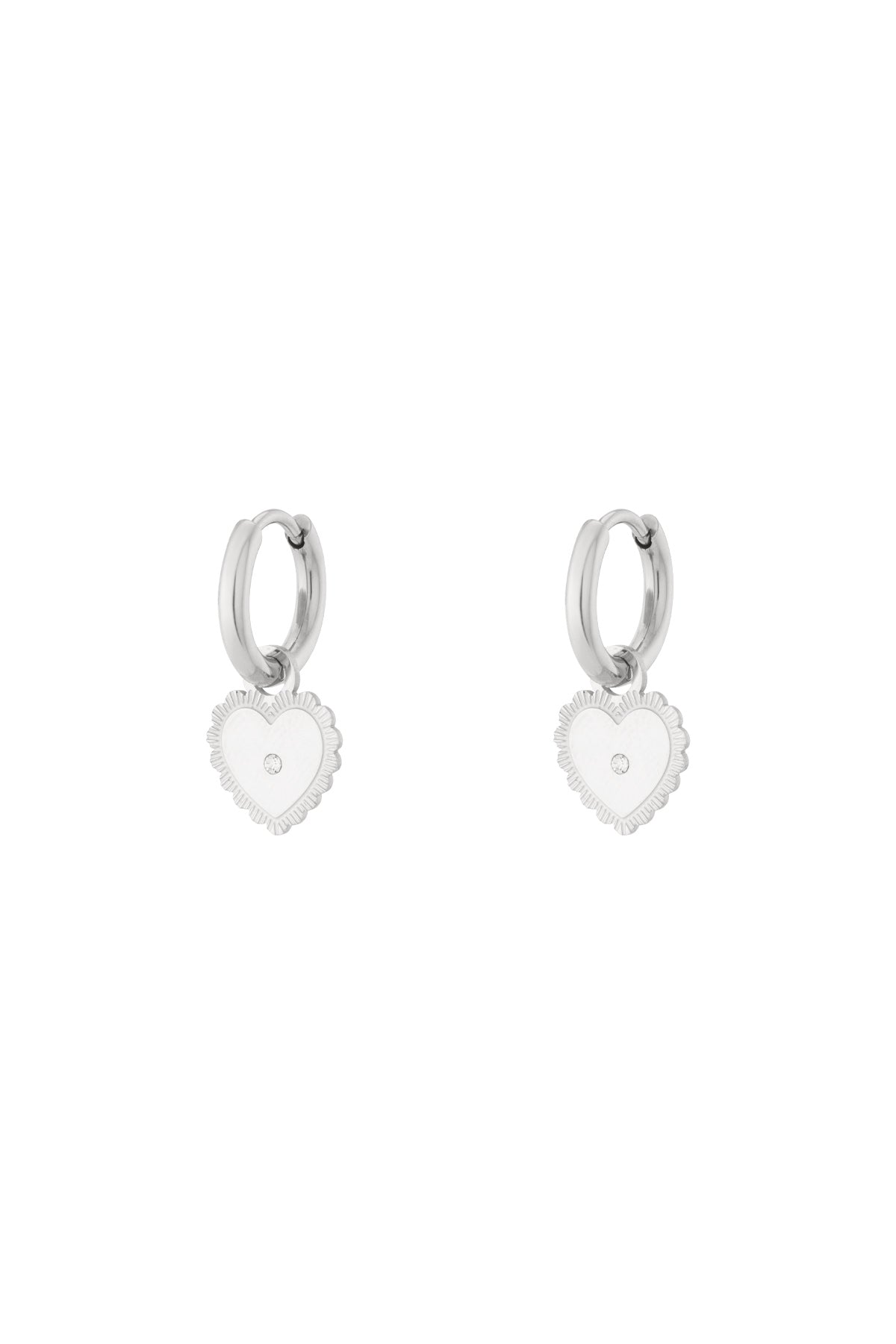 Silver hoop earrings with dangling heart charm featuring central rhinestone on white background
