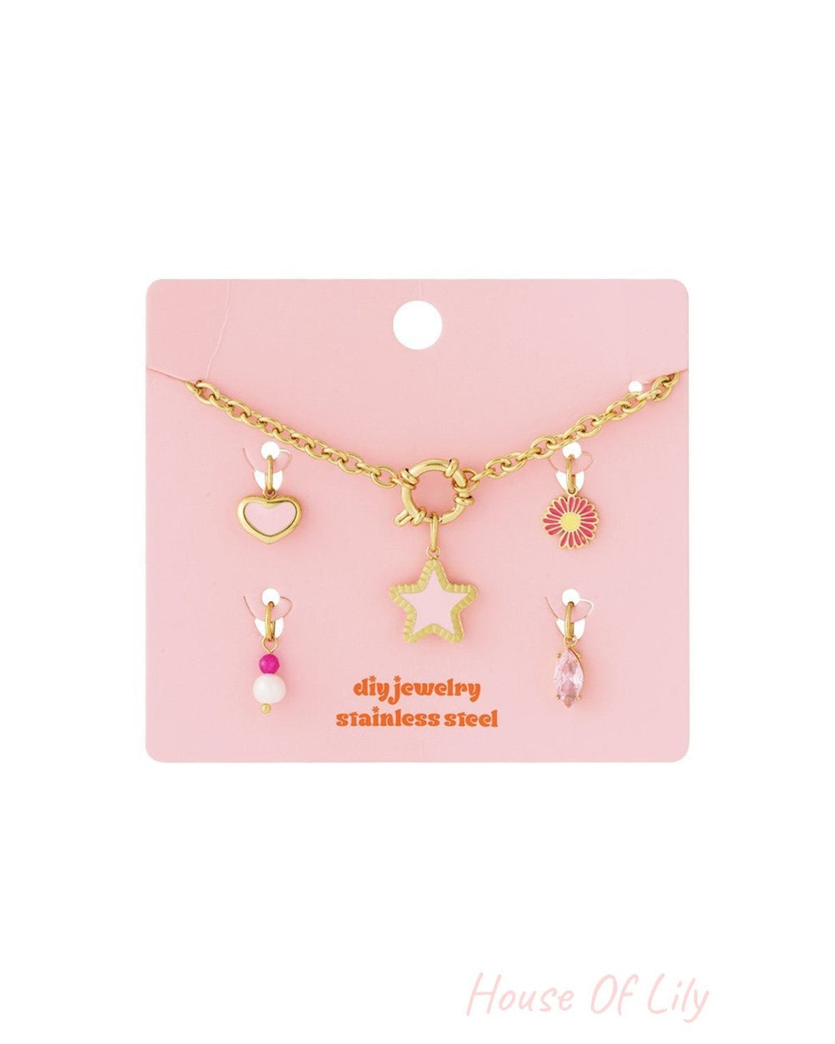 Main Character Drop gold-tone stainless steel chain necklace with removable star, heart, flower, pearl, and crystal charms.