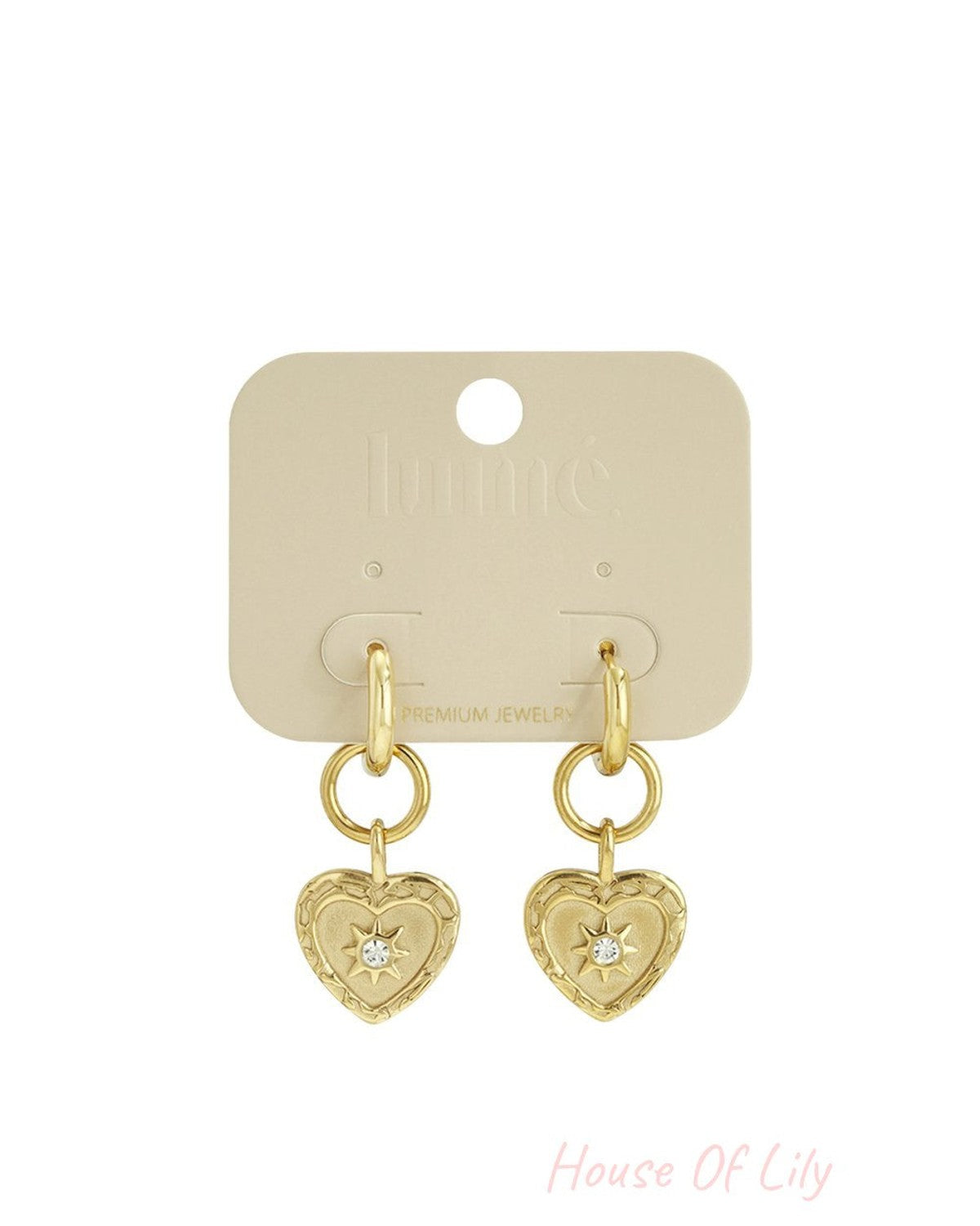 Gold hoop drop earrings featuring heart pendants with intricate filigree borders and a center crystal star inlay.