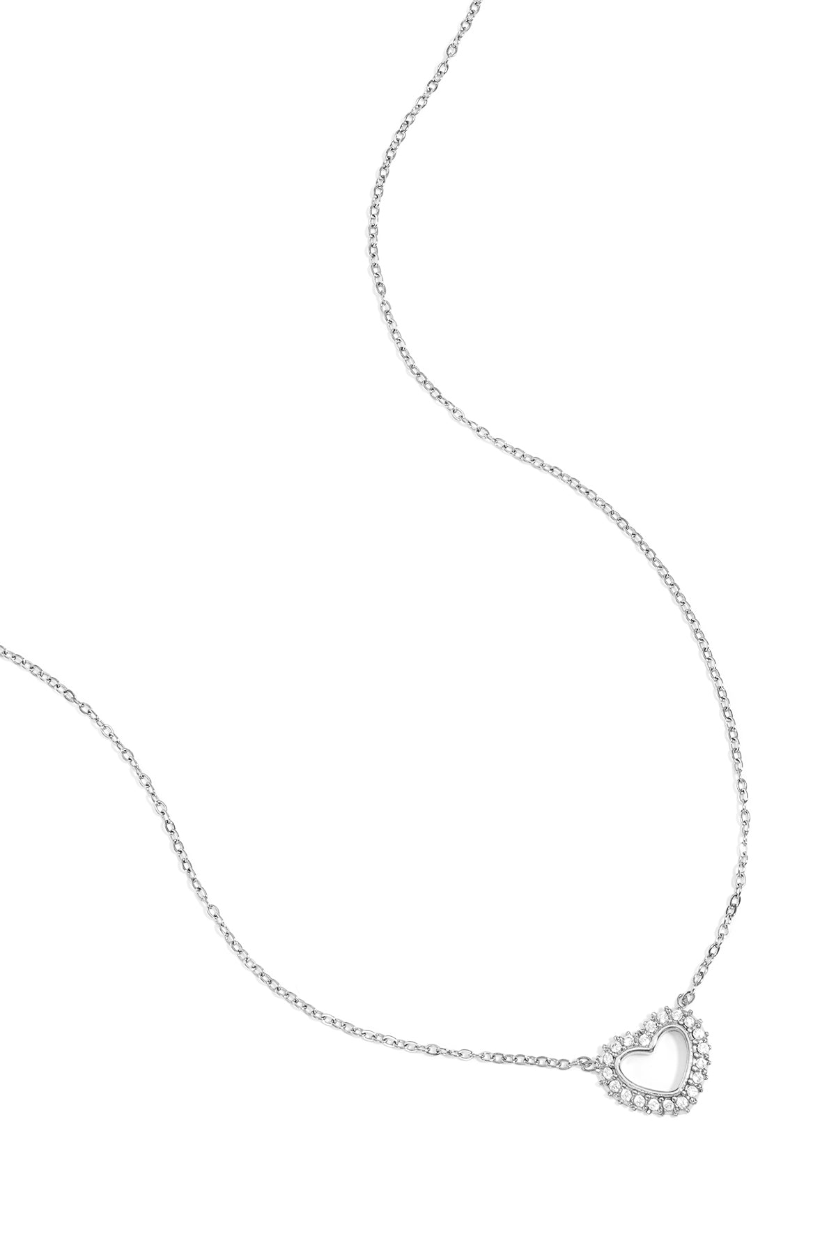 Silver heart-shaped pendant necklace with rhinestones on a delicate silver chain displayed on white background