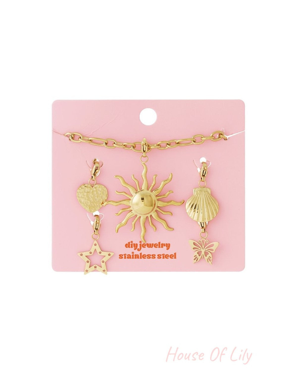Golden Glow Up: Gold stainless steel jewelry kit featuring a chain and charms shaped like a sun, heart, shell, and star.