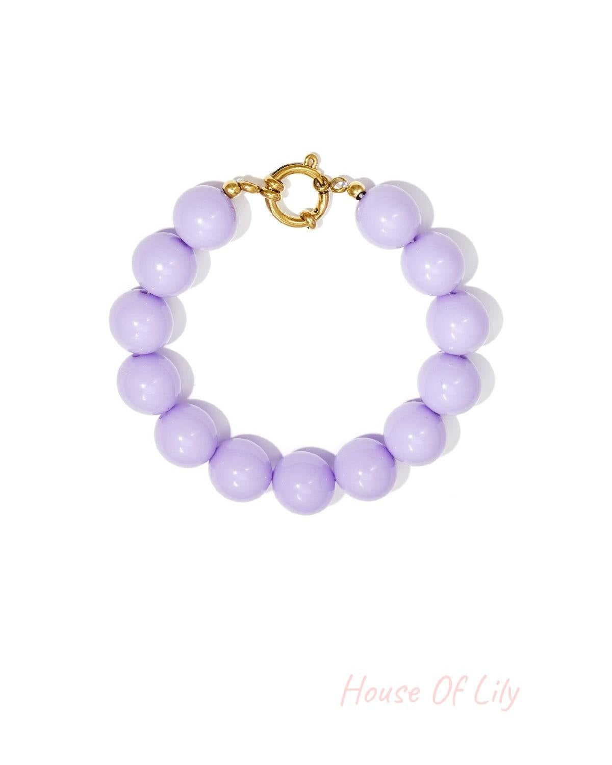 Lilac chunky beaded bracelet showcasing glossy resin beads and decorative gold clasp