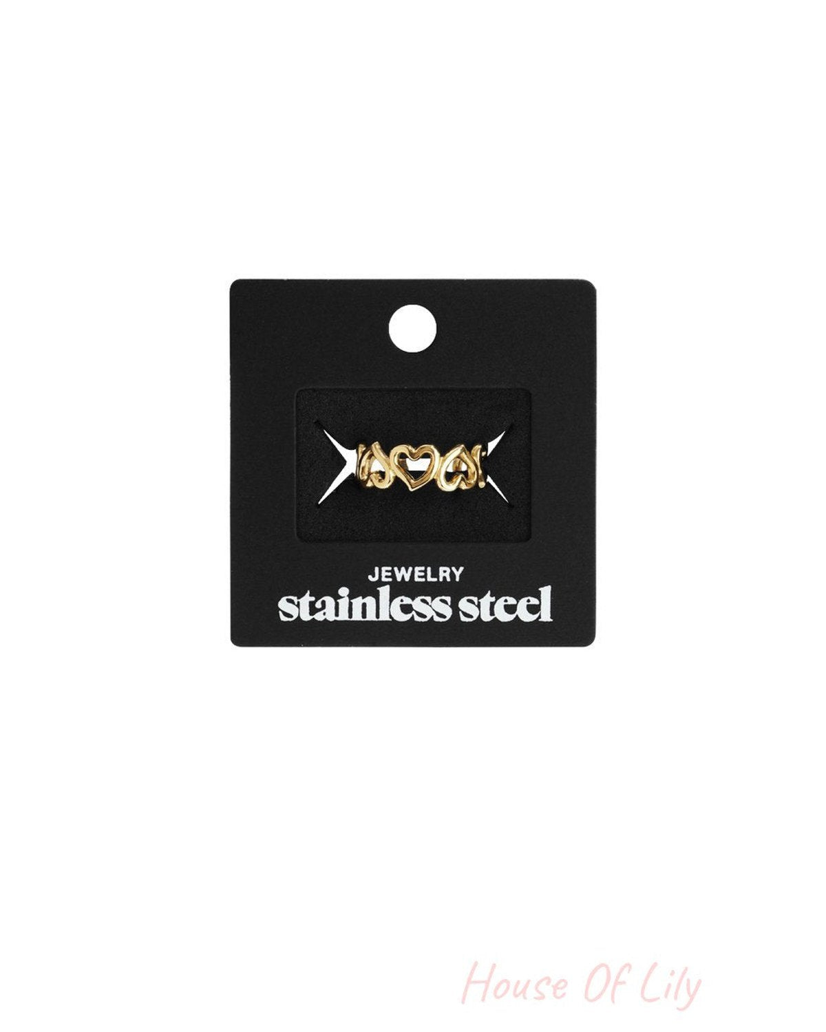 Gold-tone stainless steel Little Heart ring featuring a delicate repeating heart band on a black display card.
