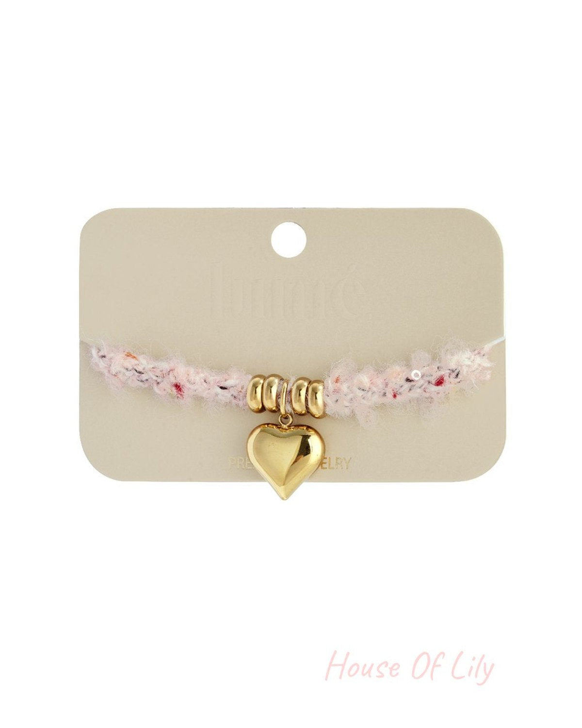 Soft Heart Charm Bracelet on card: fuzzy light pink yarn band with gold-tone beads and a polished gold heart charm.