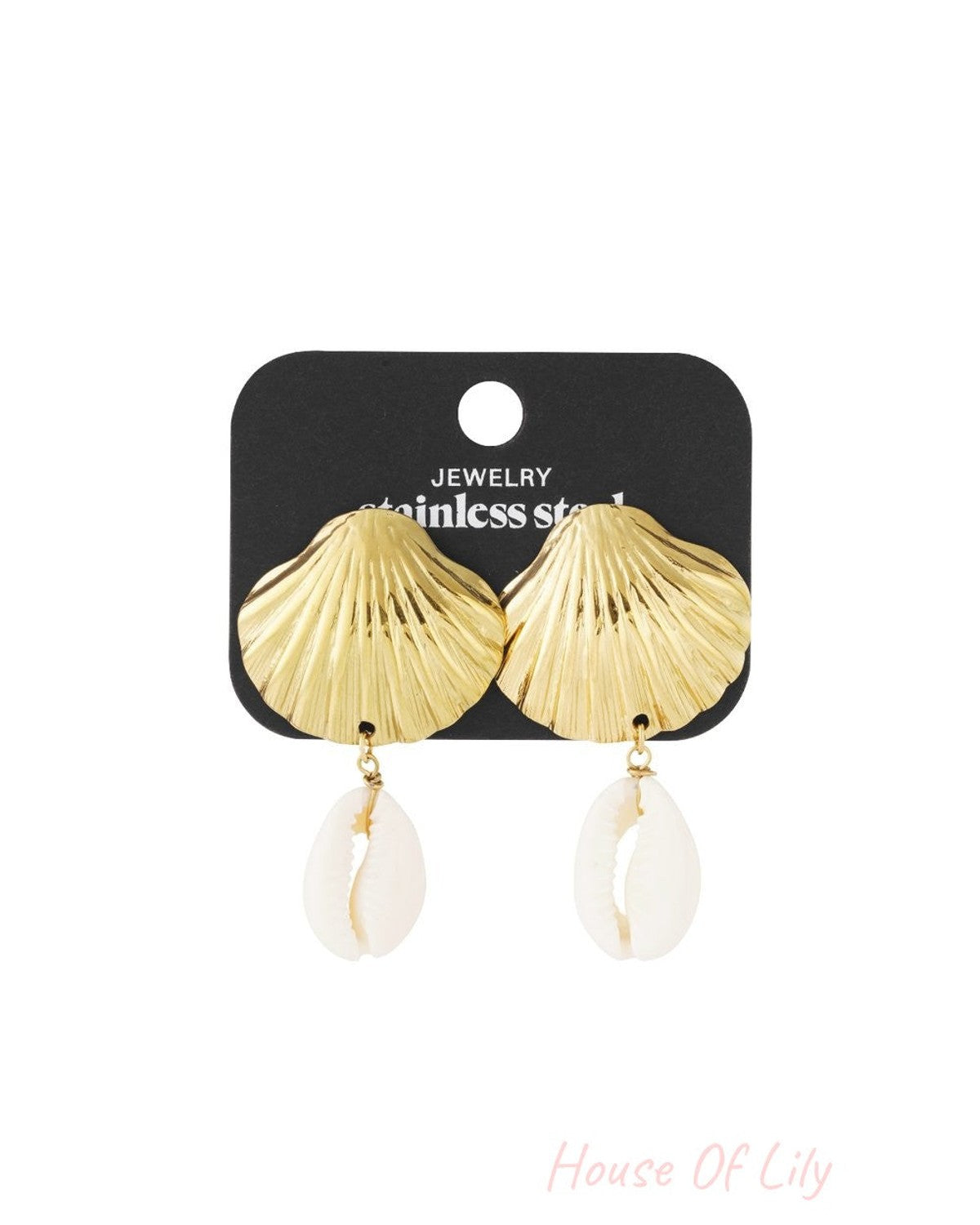 Gold scallop shell stud earrings with dangling white cowrie shell charms on a black display card.