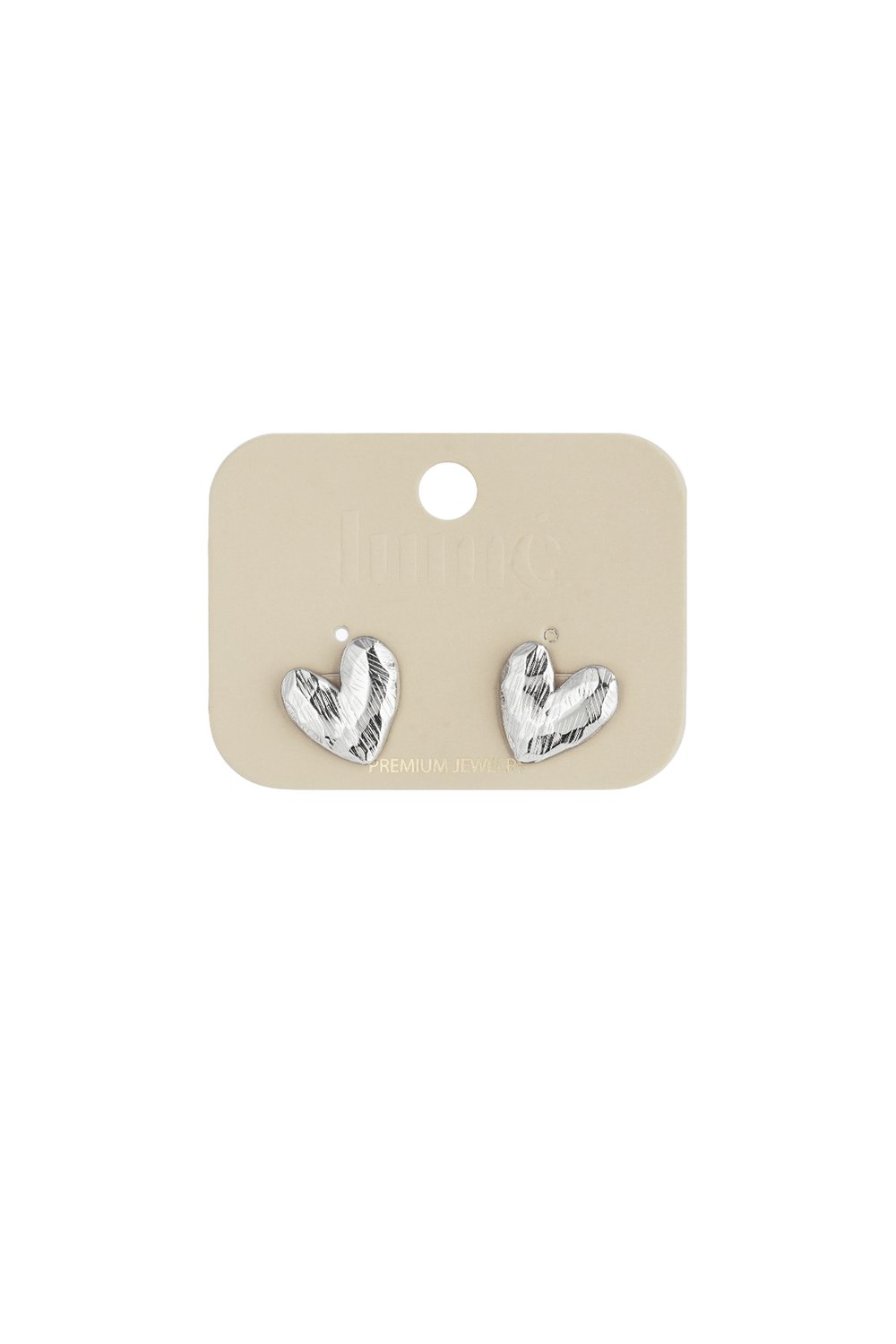 Silver Puffy Heart Hype stud earrings featuring a textured, metallic finish on a display card.