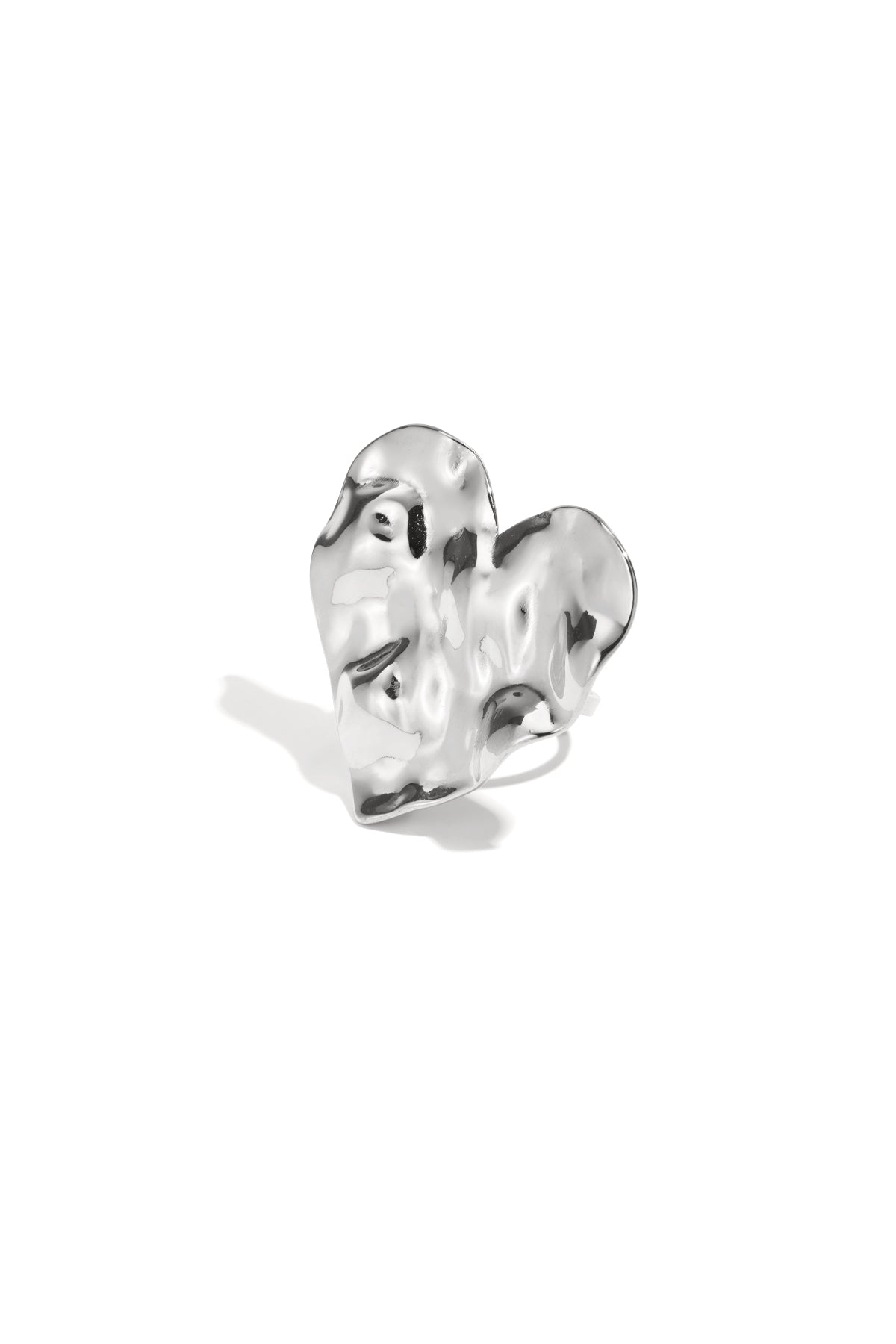 Silver textured heart statement ring close-up on white background
