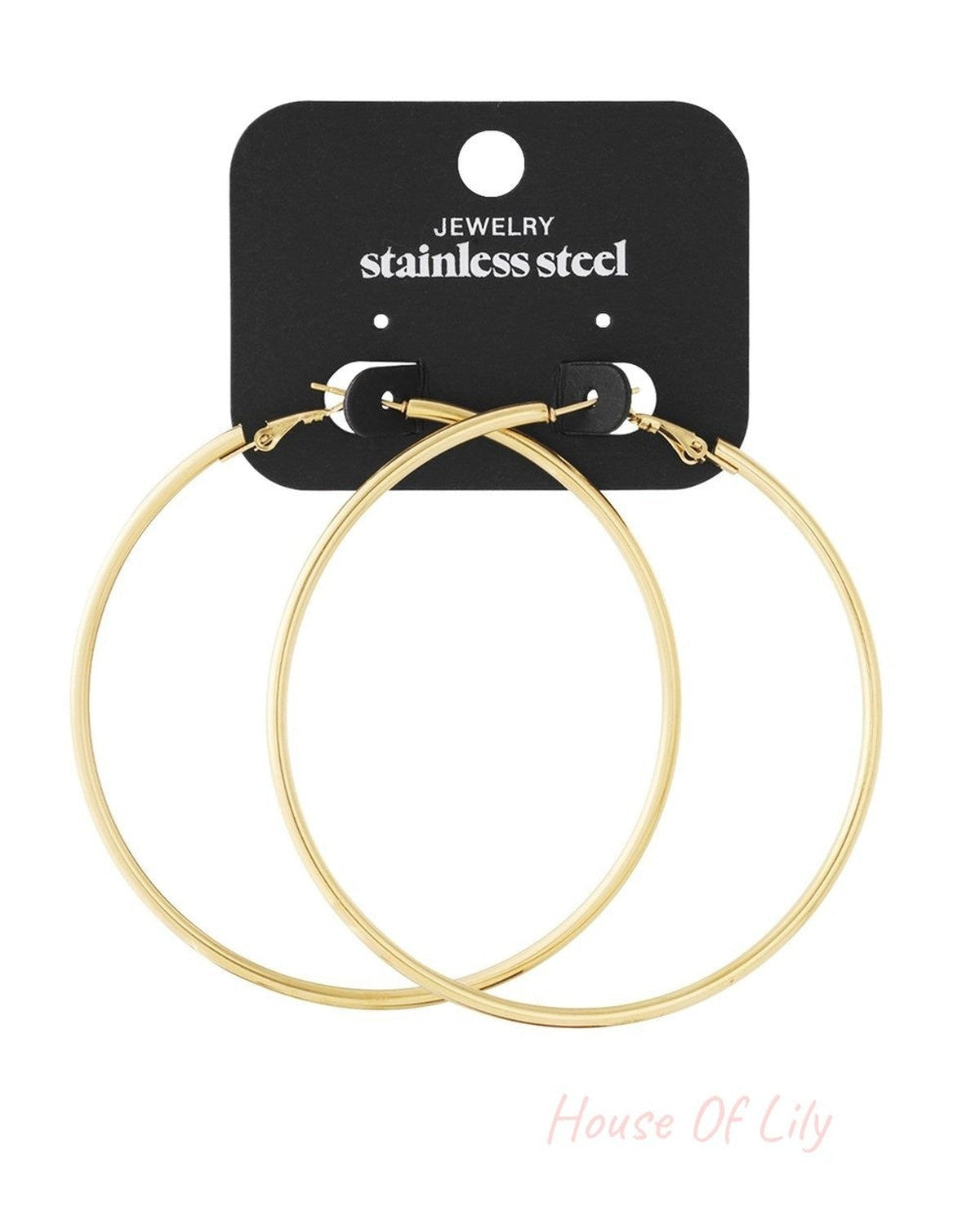 Cloud Drift Loops: Large, minimalist gold-tone stainless steel hoop earrings on a black display card.