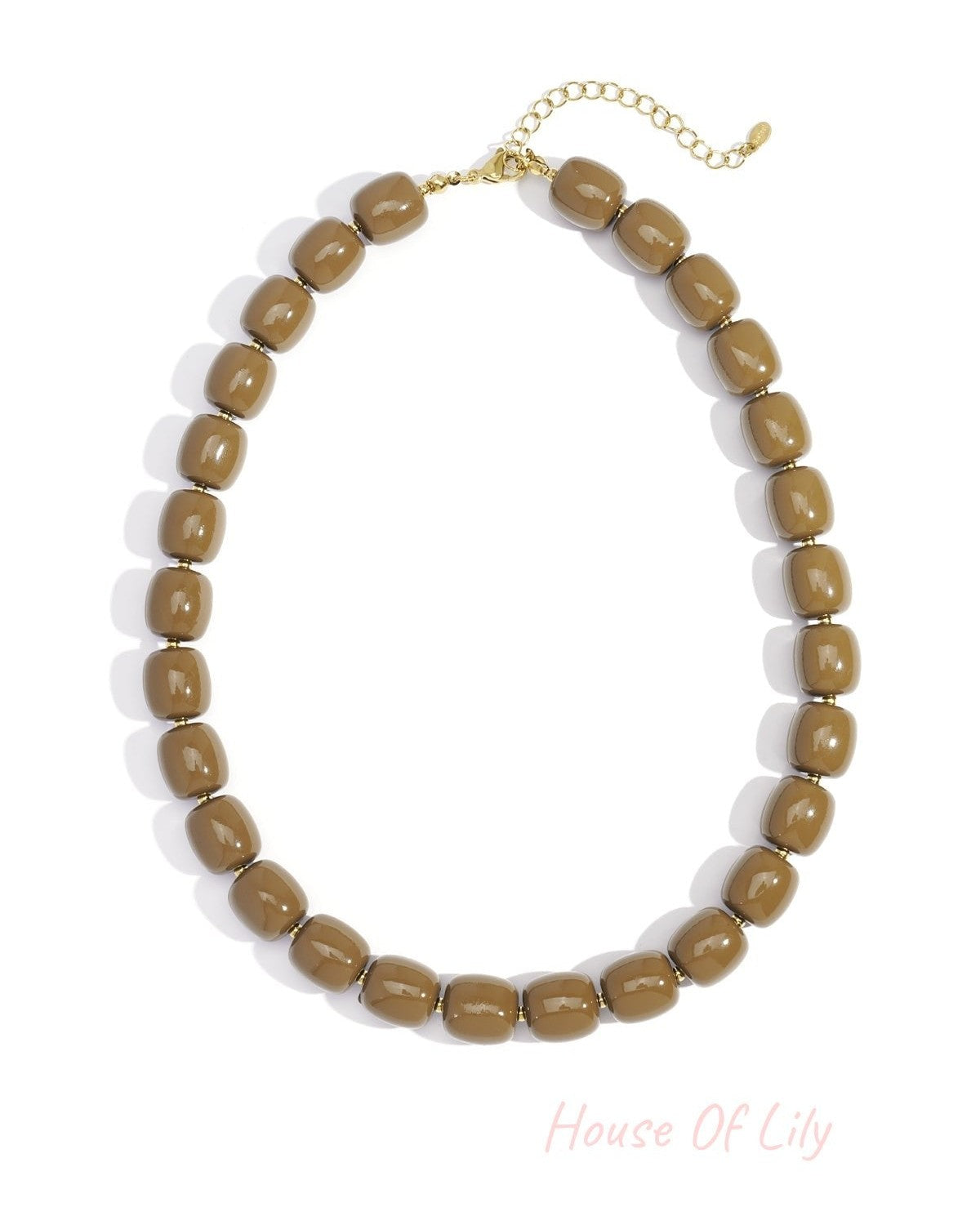 Close-up of coffee brown chunky acrylic bead necklace with gold-tone chain extension on white background