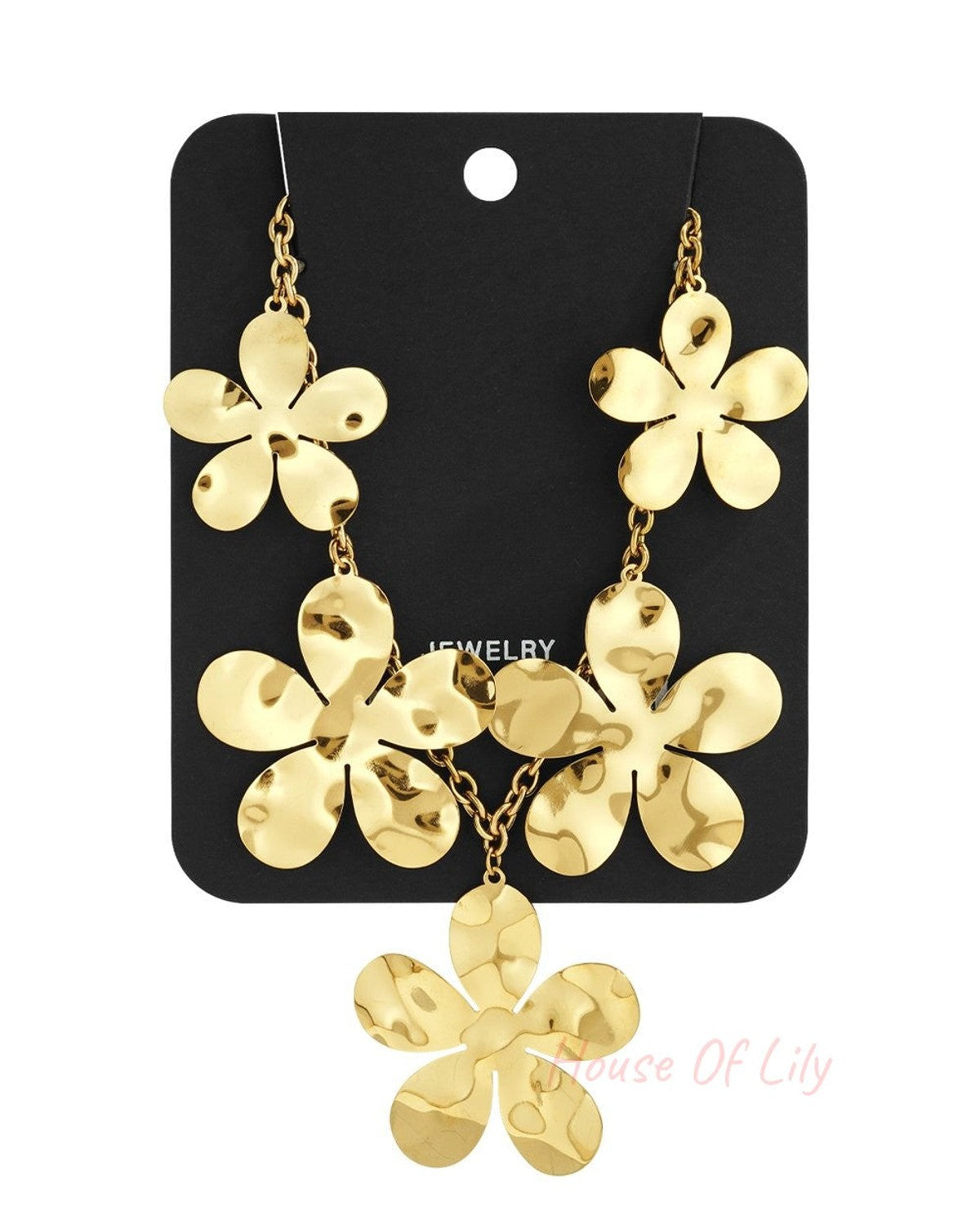 Gold-tone hammered daisy flower statement necklace on a black jewelry display card.