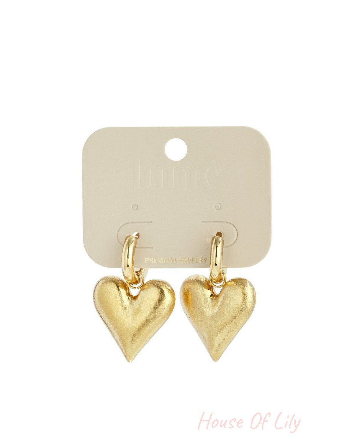 Sweet Heart Drops: Gold-tone hoop earrings with brushed metal heart pendants on a display card.