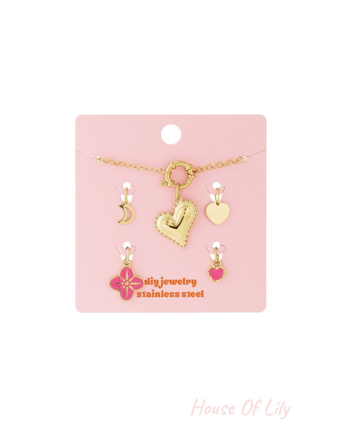 Gold-tone stainless steel Whimsical Love charm bracelet featuring heart, moon, and pink enamel flower pendants.