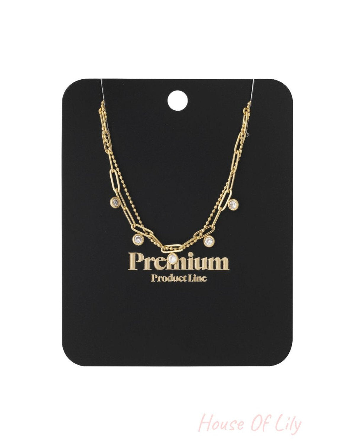 Glow Up Gems gold-tone layered necklace with a beaded chain, paperclip chain, and sparkling round crystal charms.