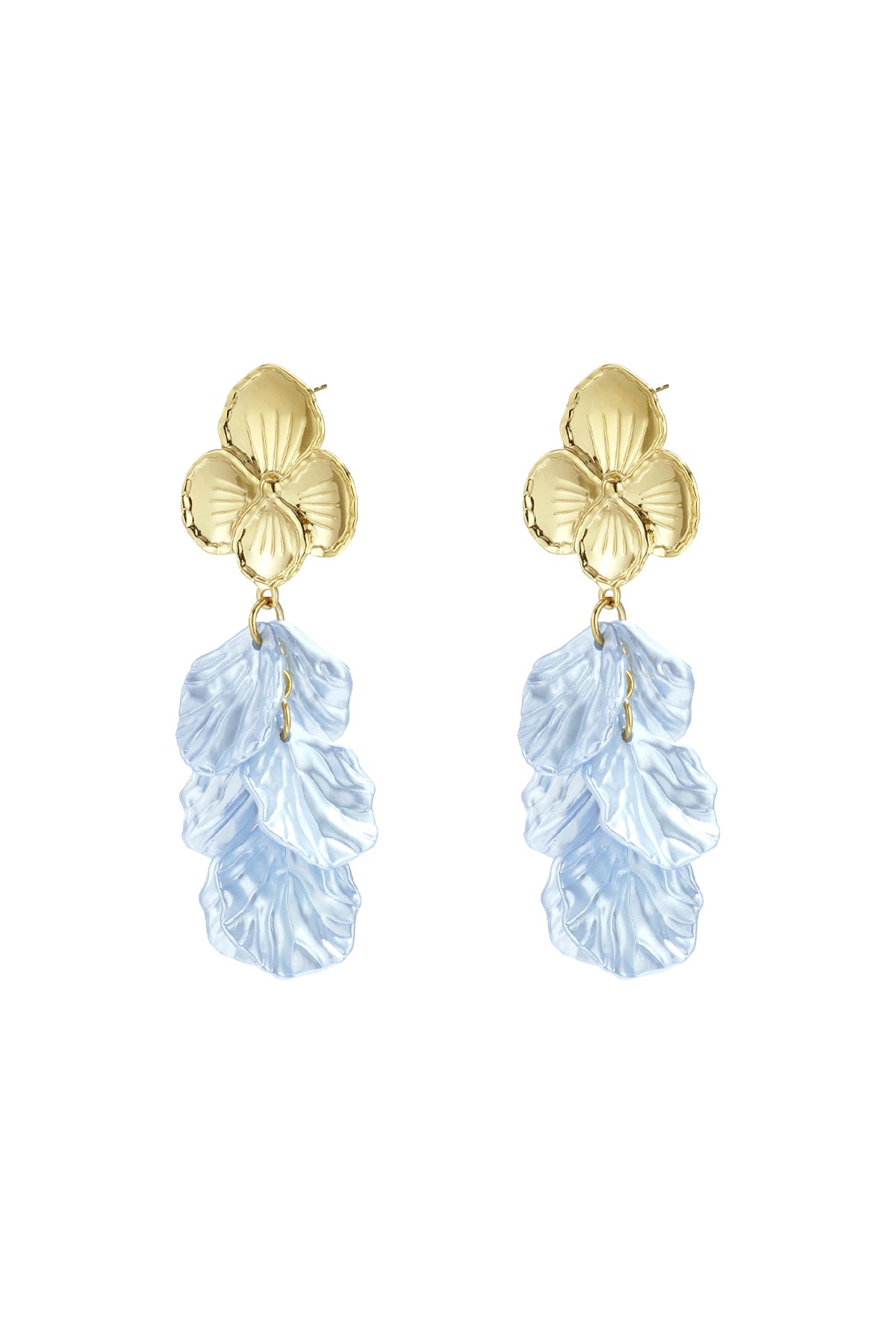 Close-up side view of woman wearing gold flower drop earrings with blue textured petals, showing delicate detail