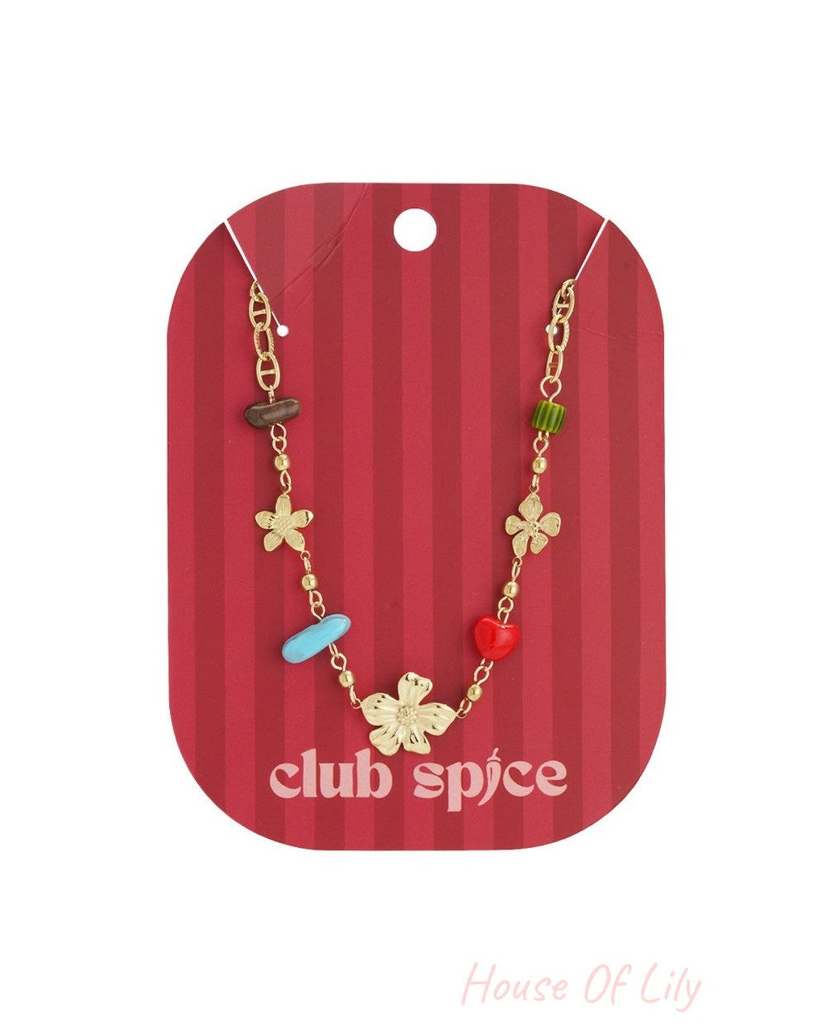 Gold-tone chain necklace featuring floral charms and colorful beaded accents on a red Club Spice display card.