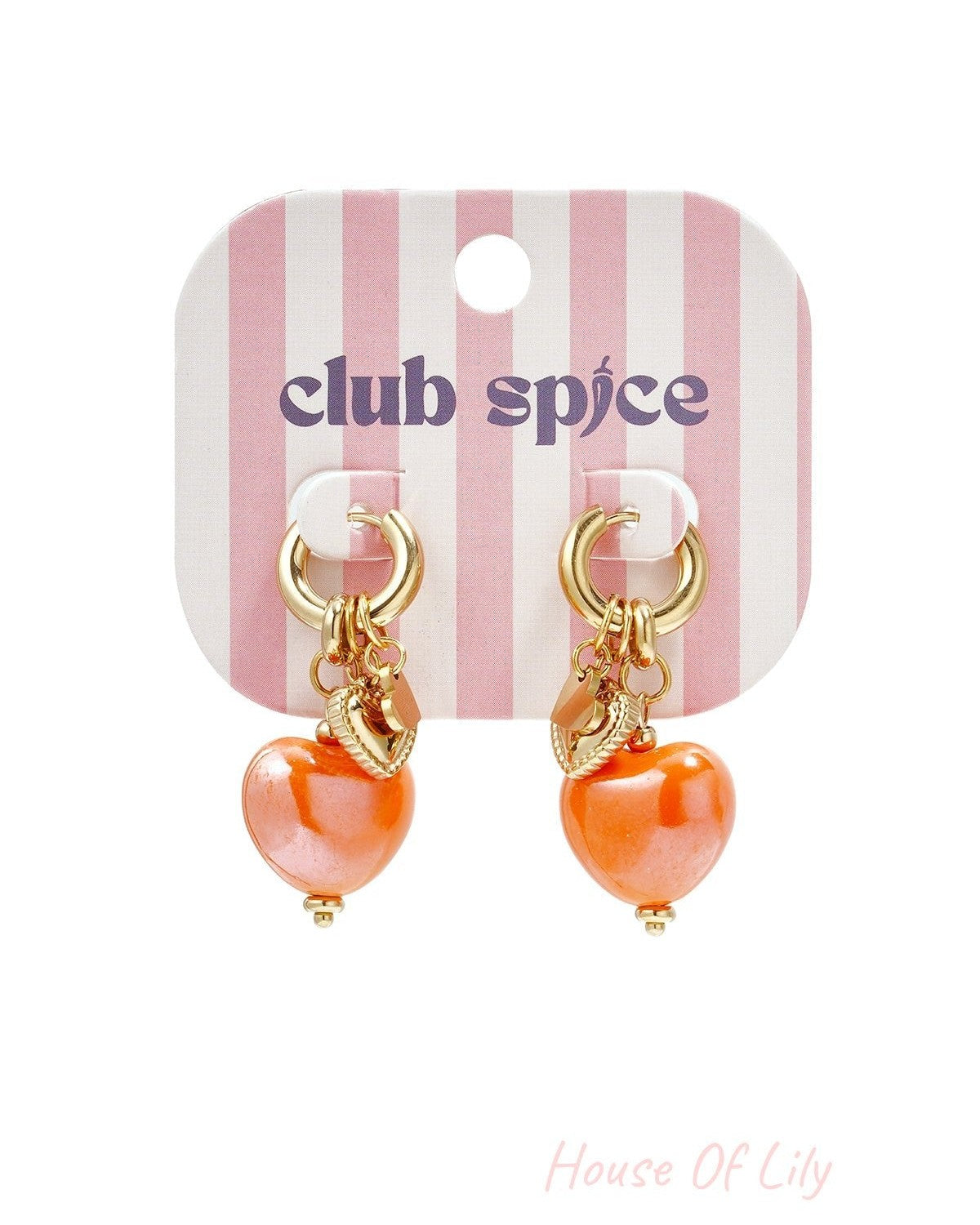 Gold hoop earrings with bright orange heart charms displayed on pink and white striped Club Spice branded card