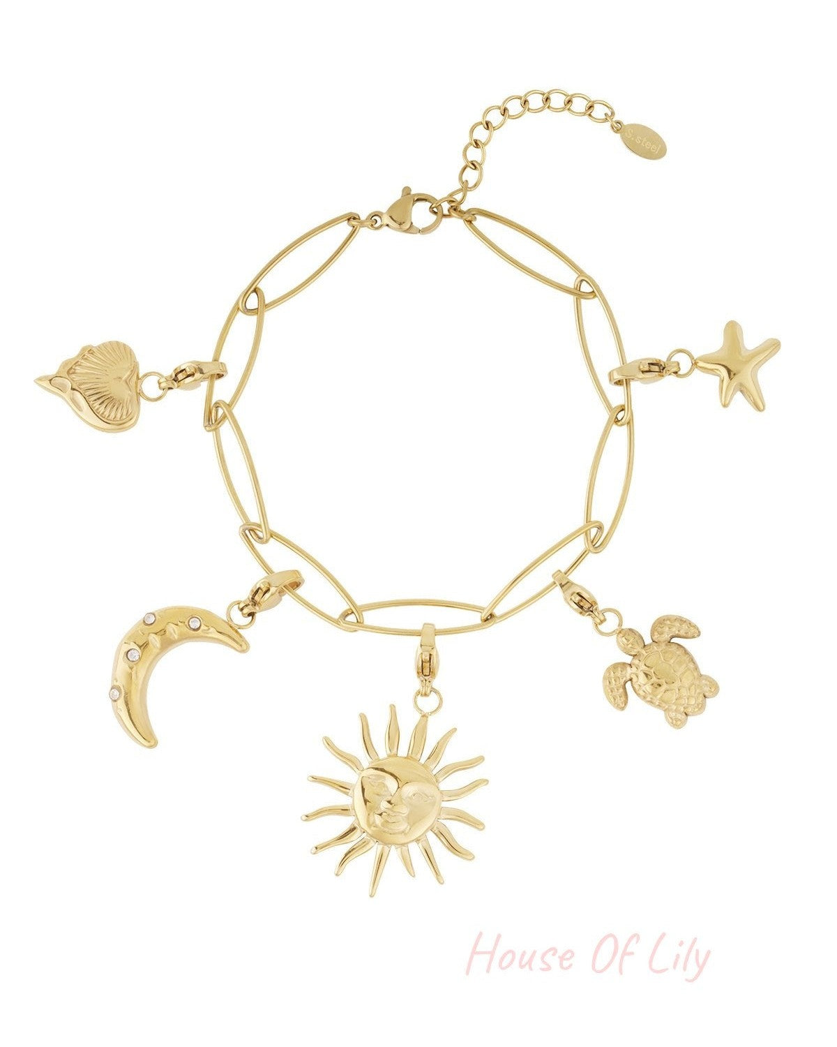 Close-up view of gold charm bracelet showing detailed celestial and sea creature charms on white background