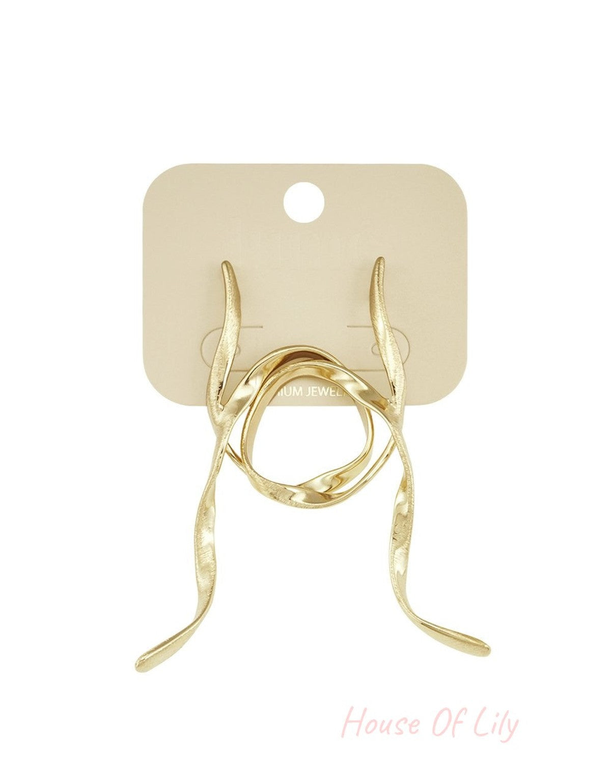 Loopy Vibe Drop earrings in brushed gold, featuring elegant, fluid sculptural loops on a jewelry display card.
