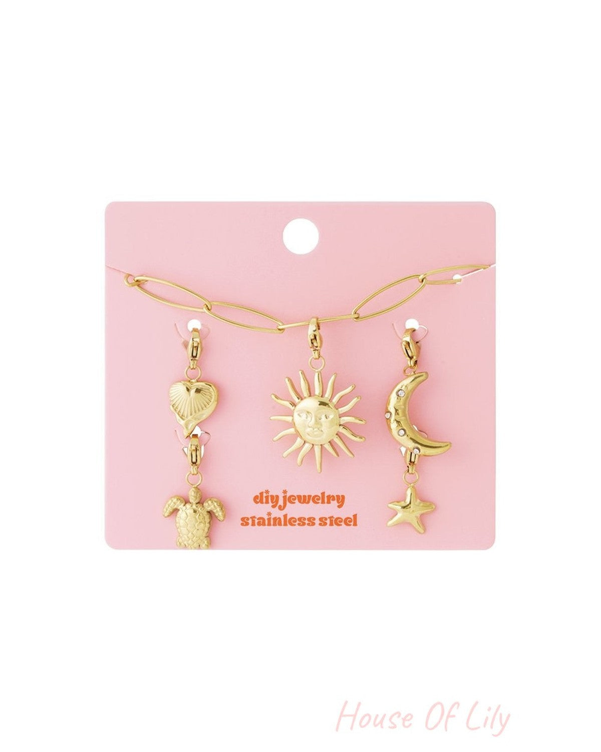 Golden Link Vibe: Gold stainless steel DIY jewelry set with chain, sun, moon, star, heart, and turtle charms on pink.