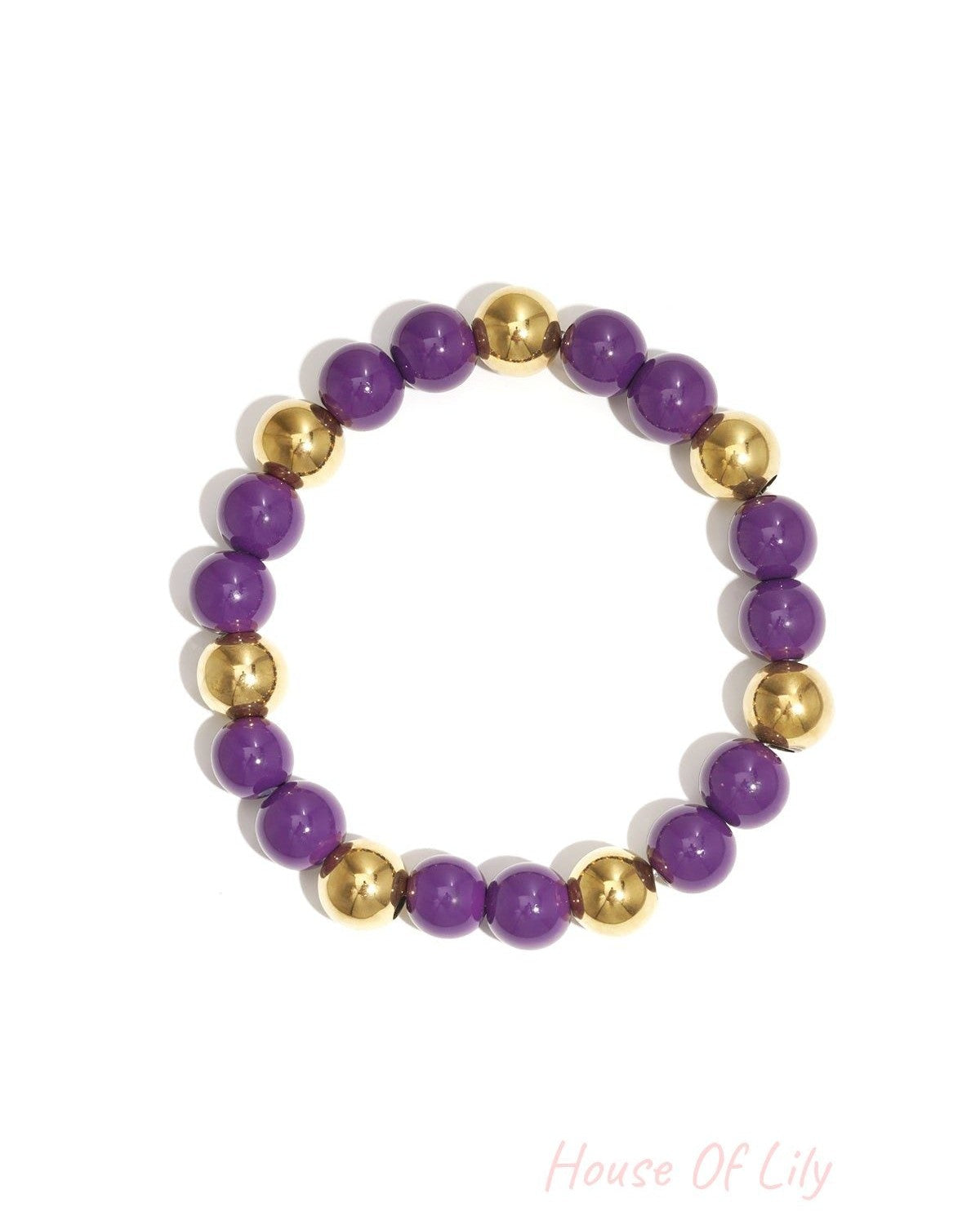 Single acrylic beaded bracelet featuring alternating purple and gold-tone beads isolated on white background
