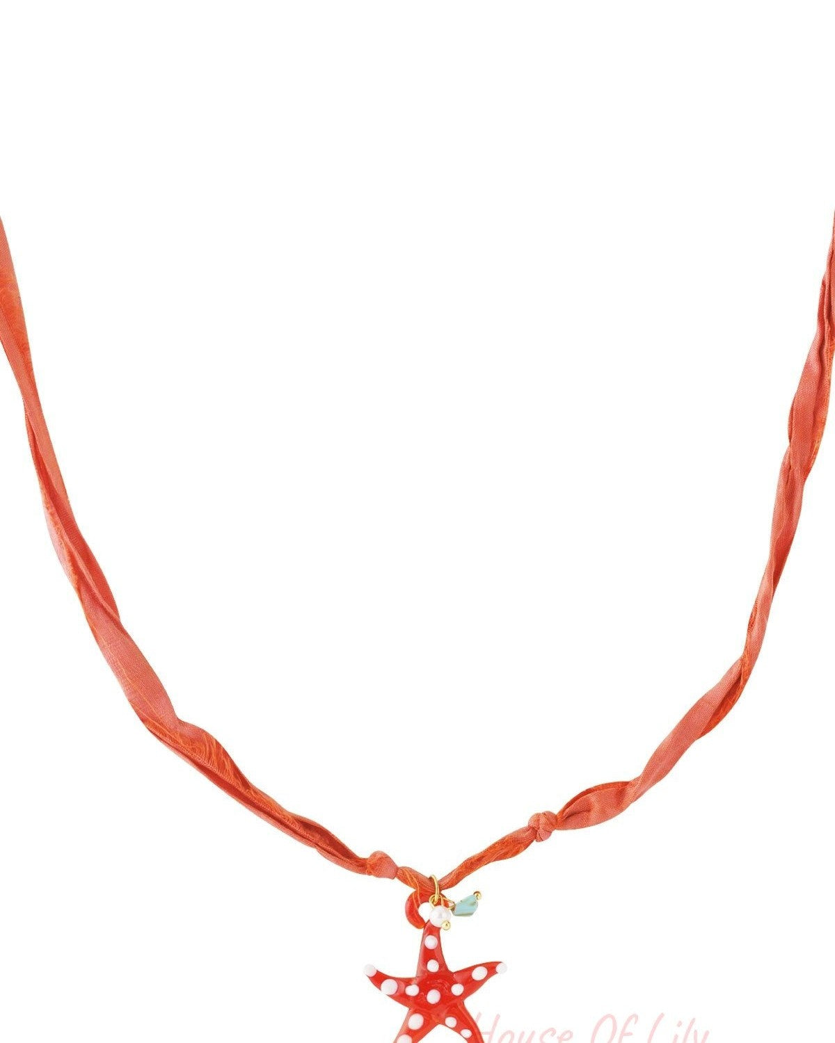 Orange fabric cord necklace with a red glass starfish pendant decorated with white spots