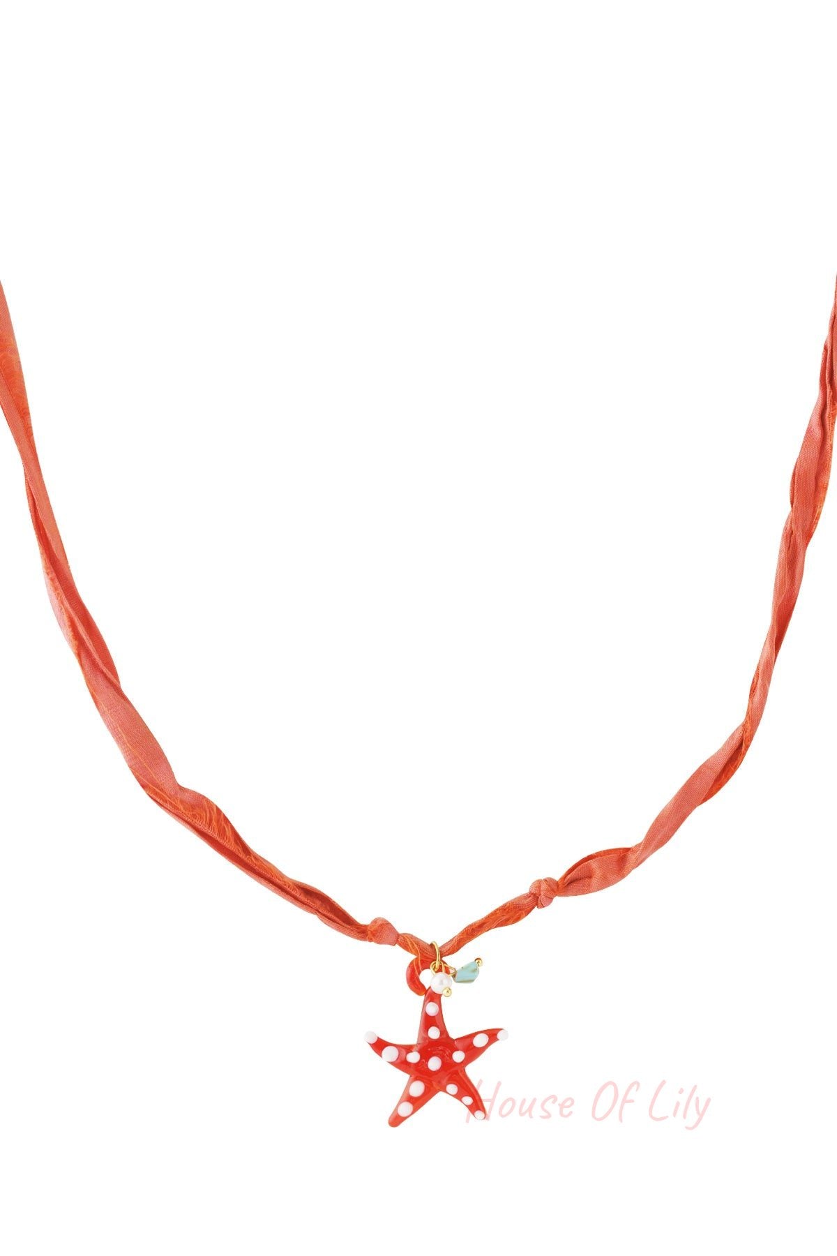 Orange fabric cord necklace with a red glass starfish pendant decorated with white spots
