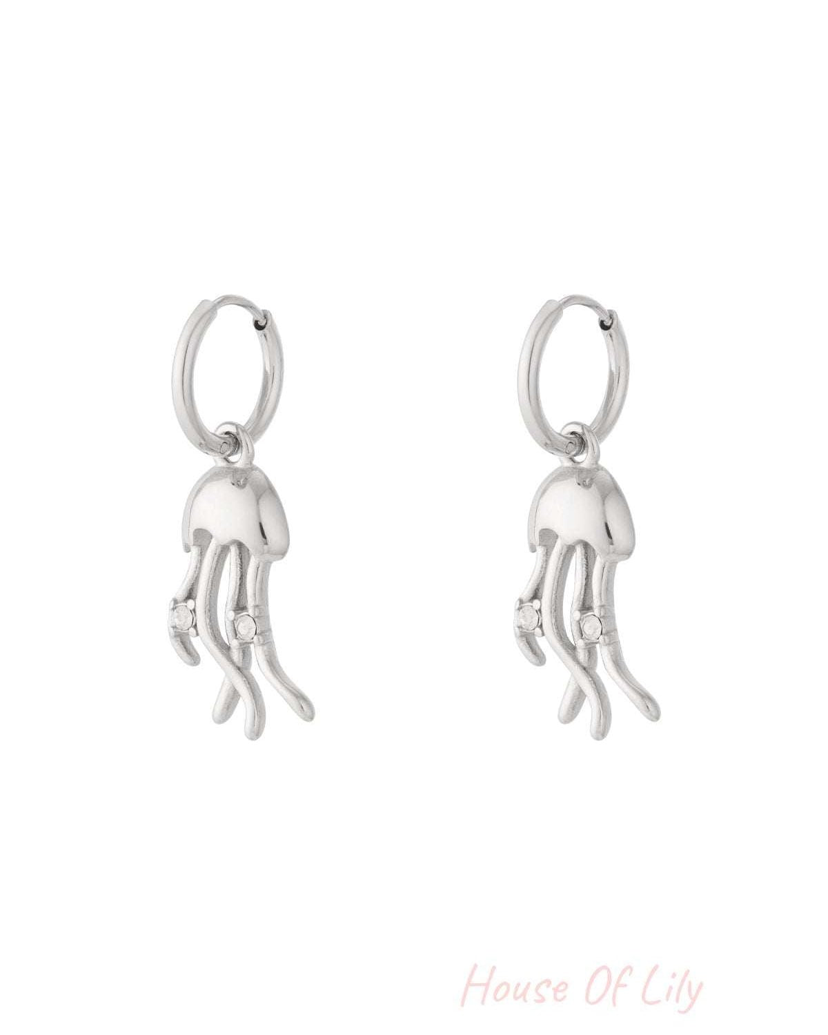 Pair of silver jellyfish drop earrings with rhinestone accents on white background