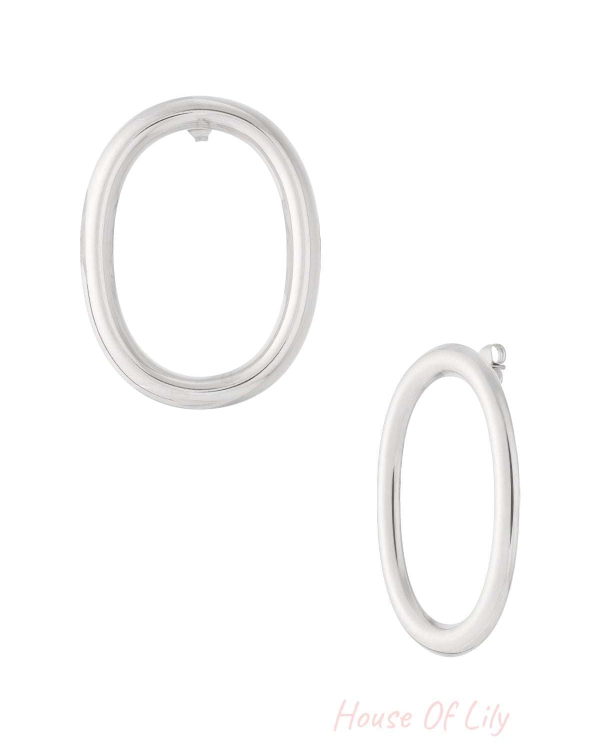 Silver oval hoop earrings shown from front and side views on white background
