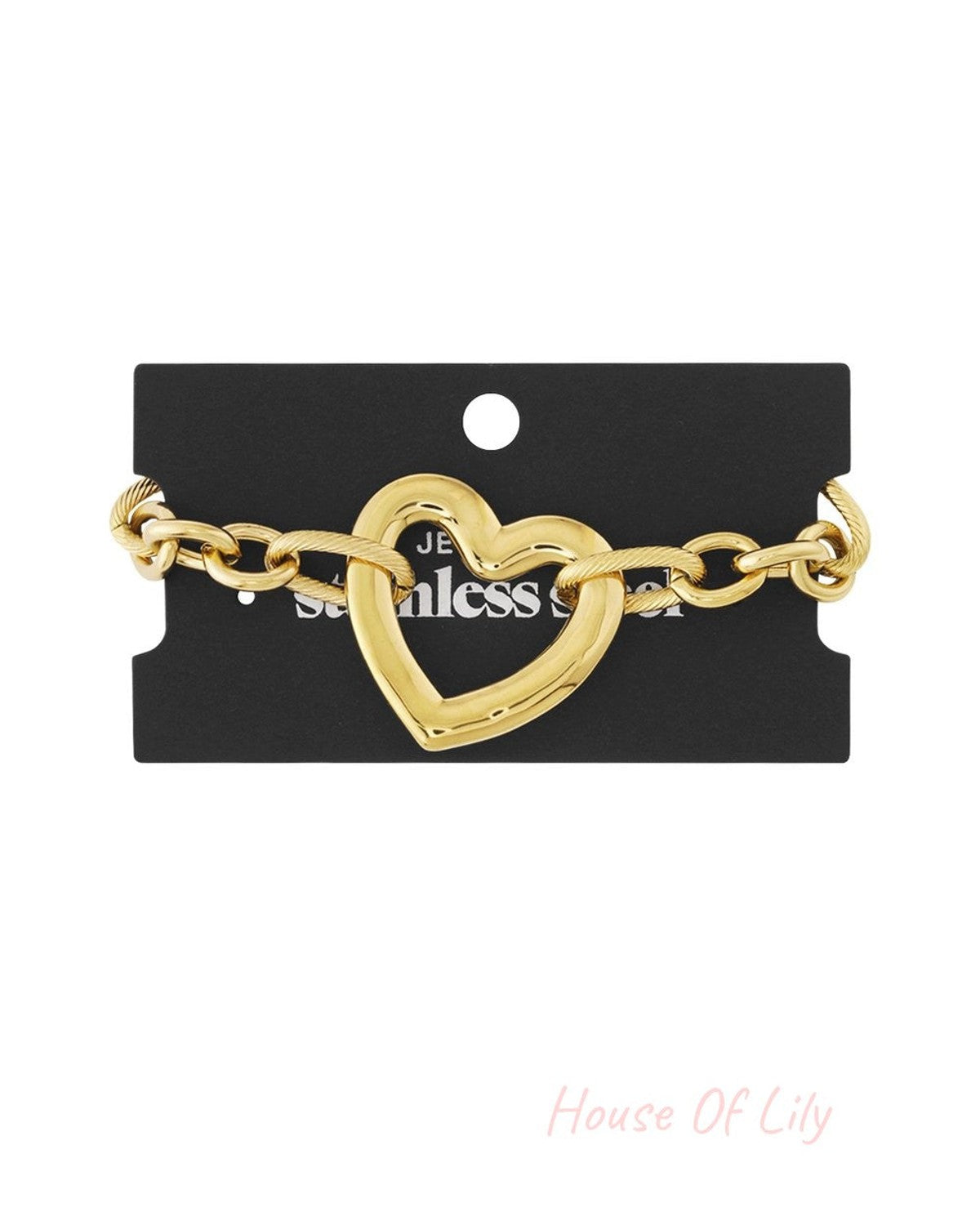 Gold-tone chunky heart charm bracelet on a black display card, featuring a textured link chain.