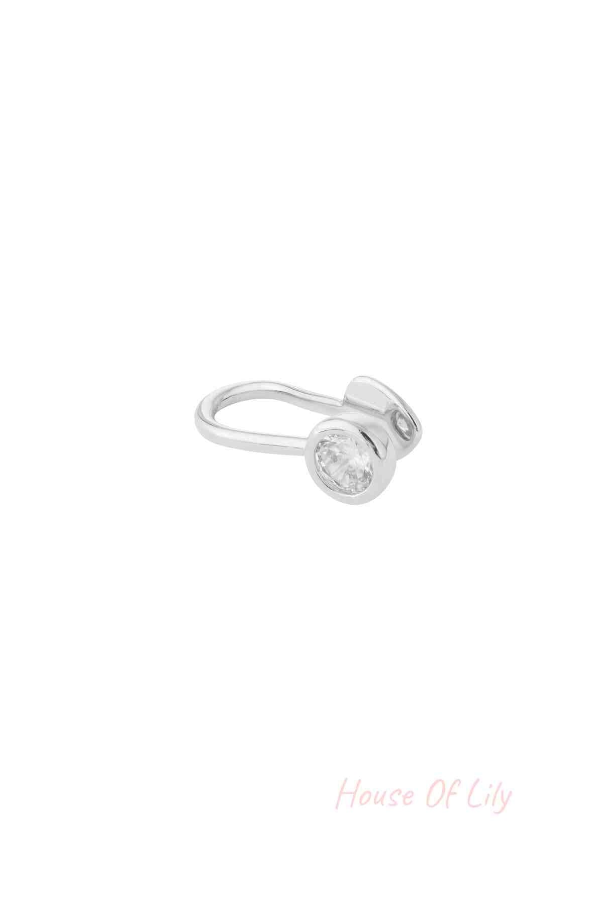 Silver-toned nose and ear cuff with sparkling zircon stone, isolated on white background
