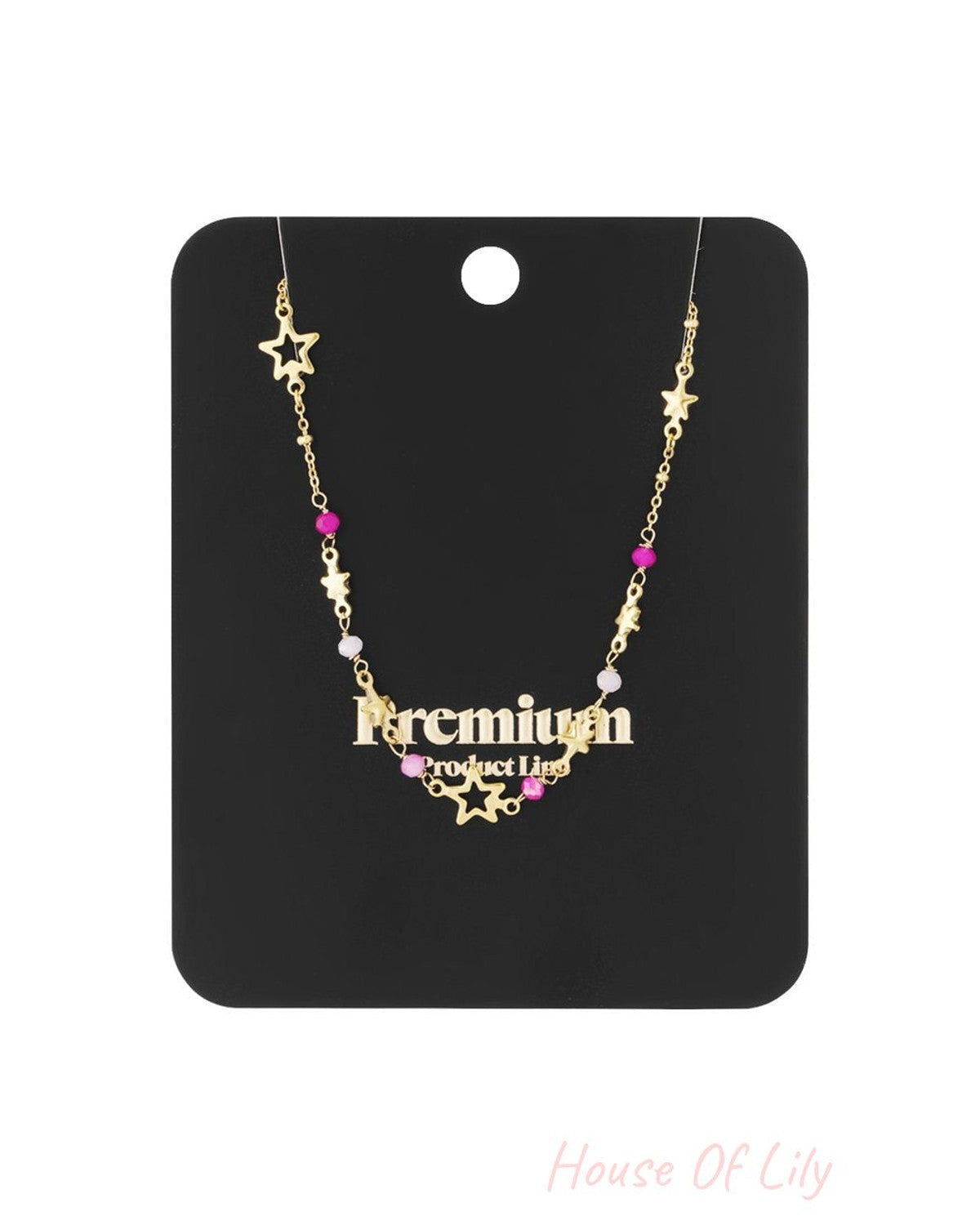 Gold-tone Starry Vibe Check necklace featuring star charms and small pink and white beaded accents on a thin chain.