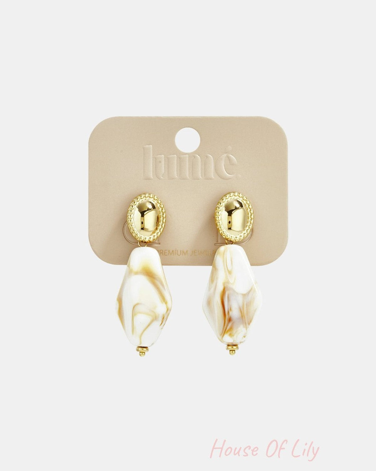 Main Character Marble Drops: Gold oval studs with white and tan marbled, diamond-shaped acrylic drop pendants.