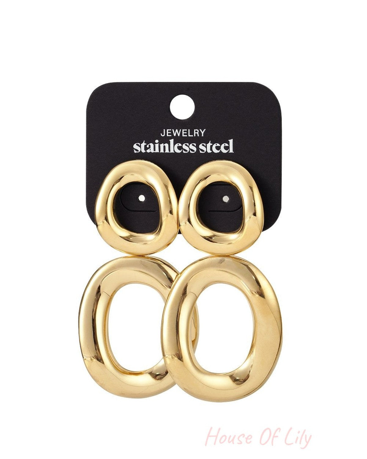 Main Character Twist Hoops: Gold-tone, twisted oval stainless steel earrings on a black display card.