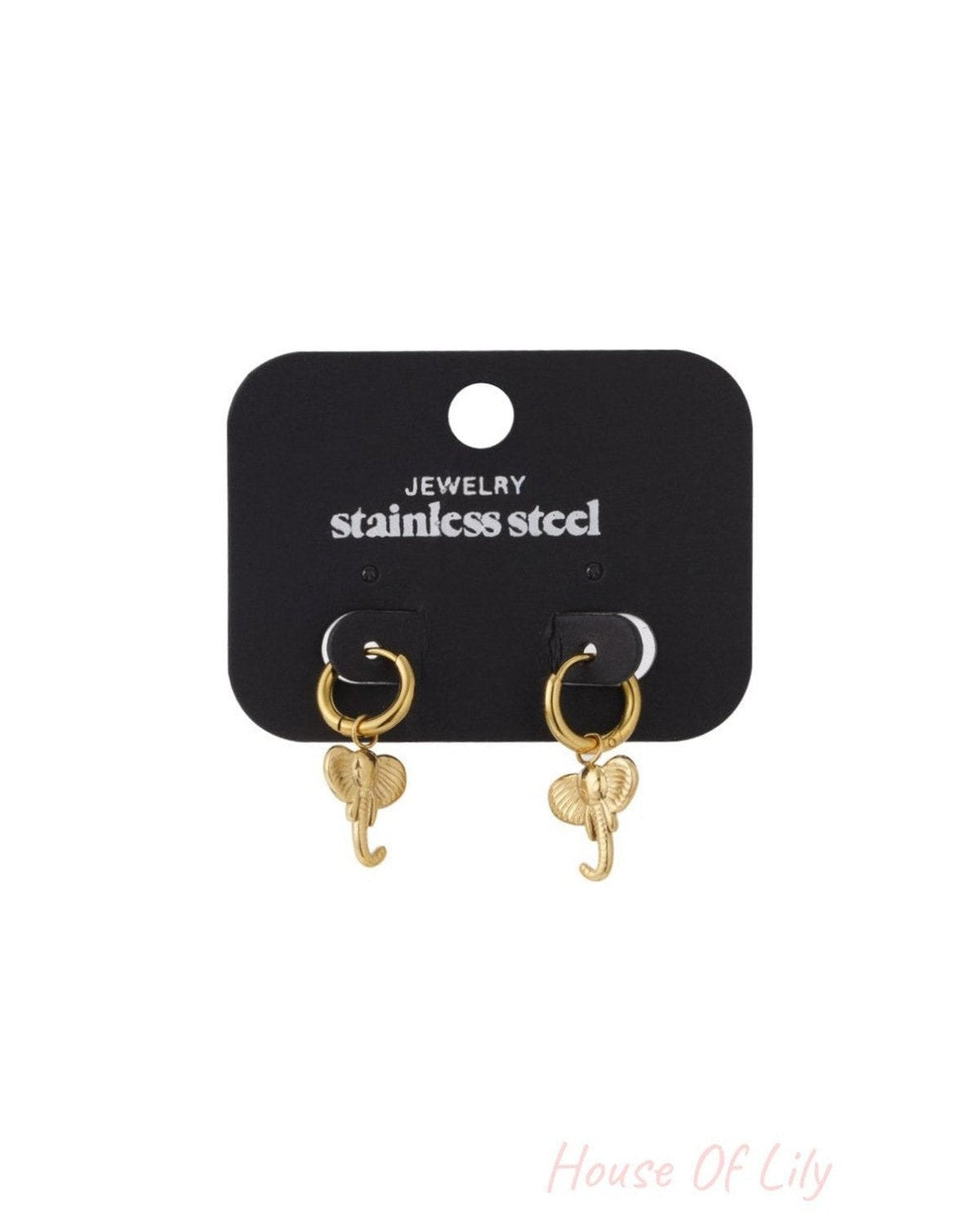 Gold-tone stainless steel hoop earrings featuring dainty elephant charms on a black display card.